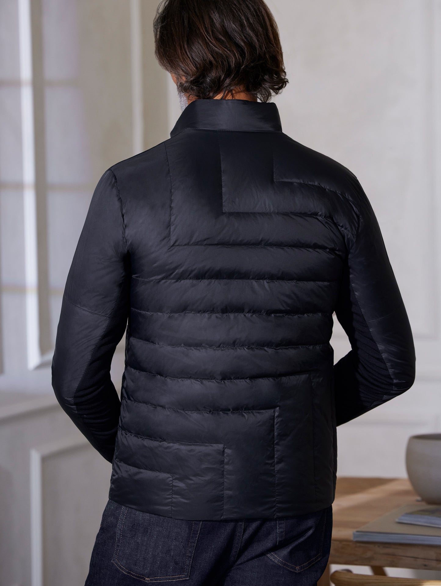 man wearing quilted black jacket