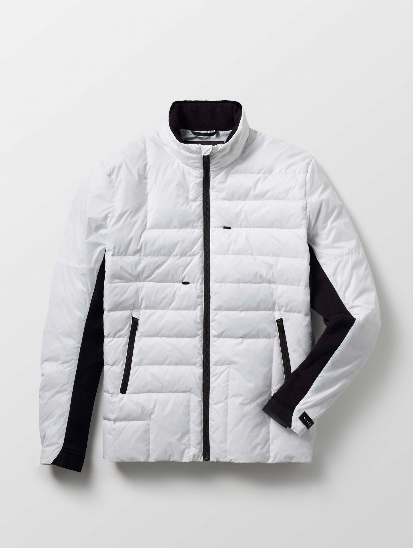 Isolated view of man wearing white Ghost Jacket from AETHER Apparel.