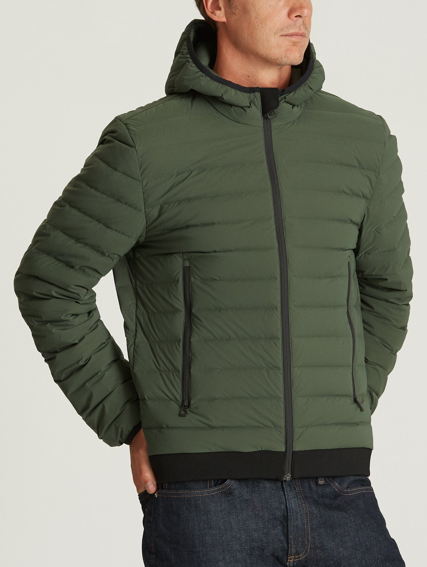 man wearing green insulated jacket