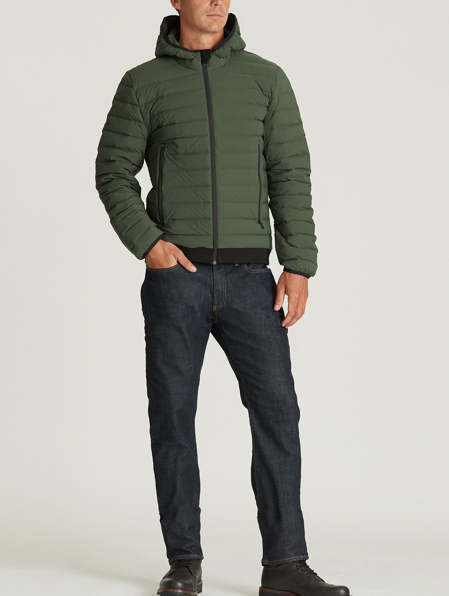 man wearing green insulated jacket