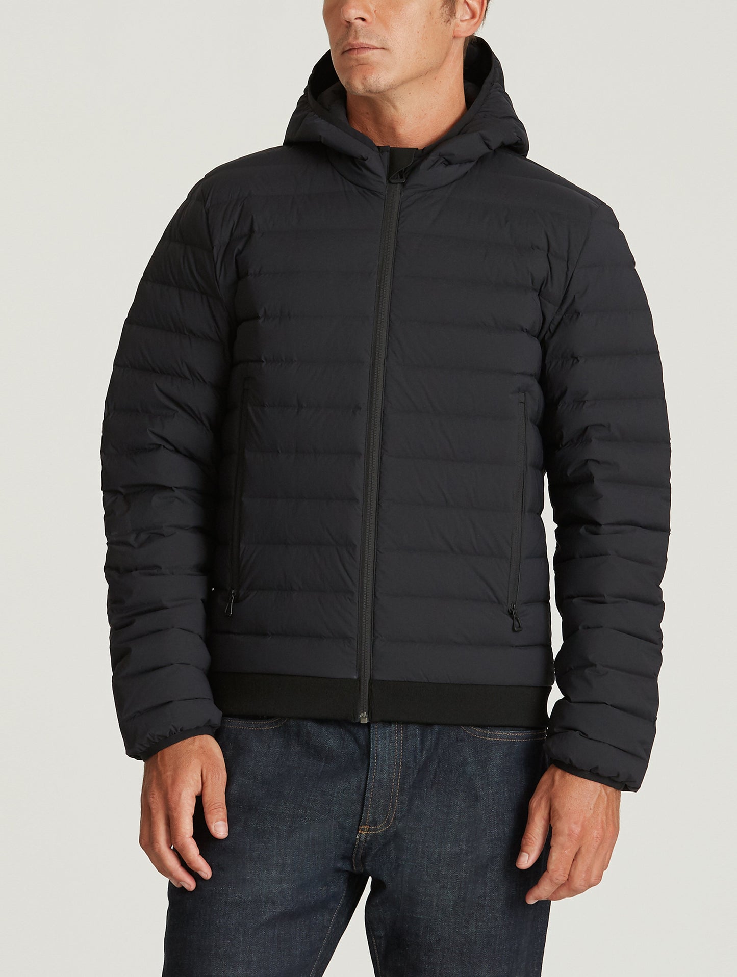 Front body view of man wearing Launch Jacket in Onyx Black from AETHER Apparel.