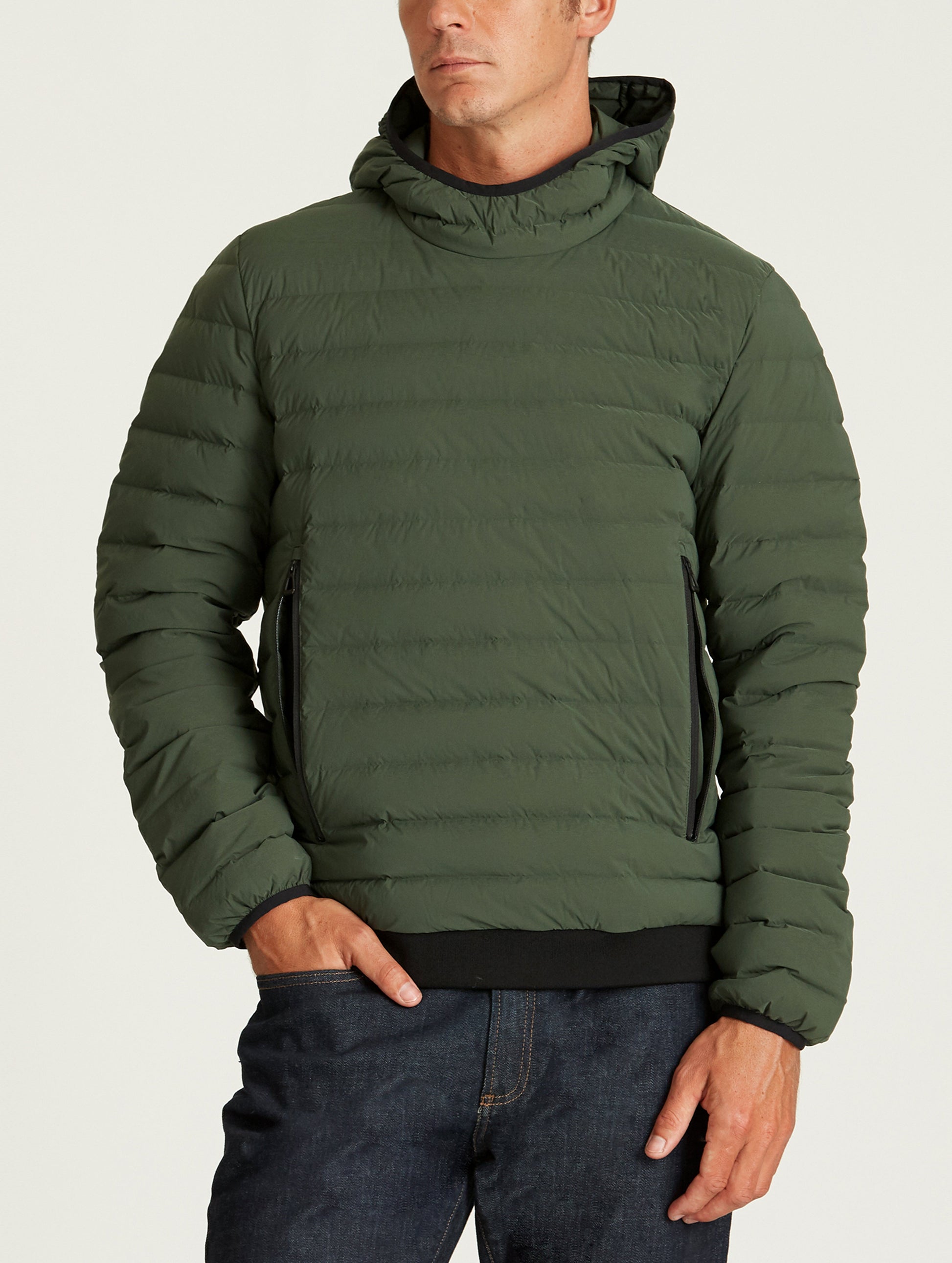 Front body view of man wearing Launch Pullover in Duffle Green from AETHER Apparel.