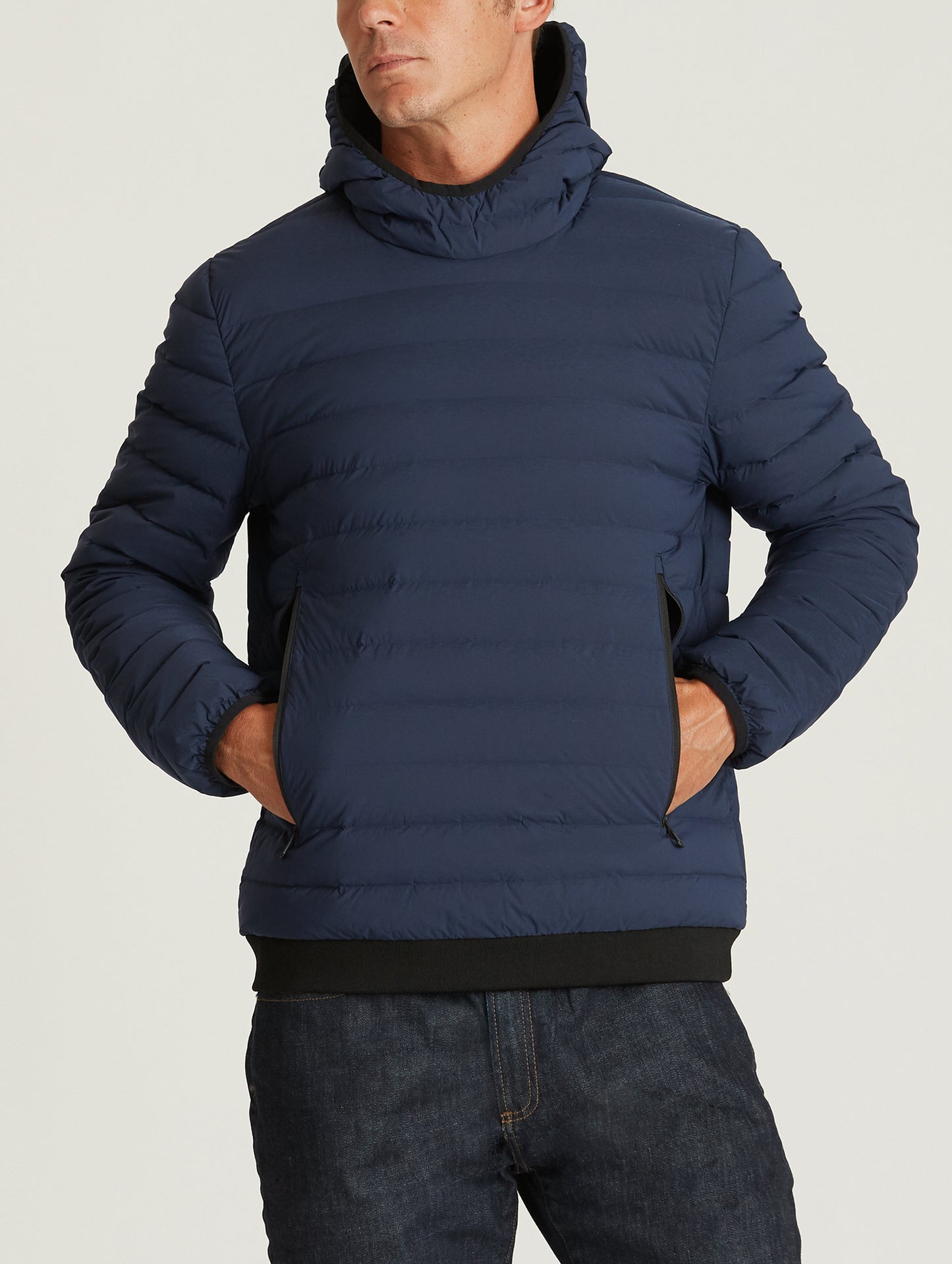 Front body view of man wearing Launch Pullover in Nordic Navy blue from AETHER Apparel.