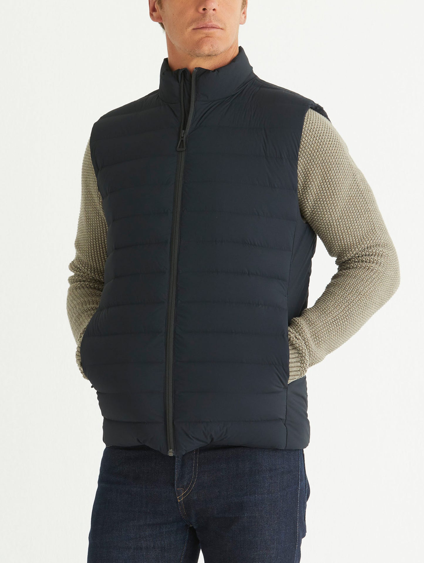 Front 3/4 body view of man wearing Launch Vest in Onyx Black from AETHER Apparel.