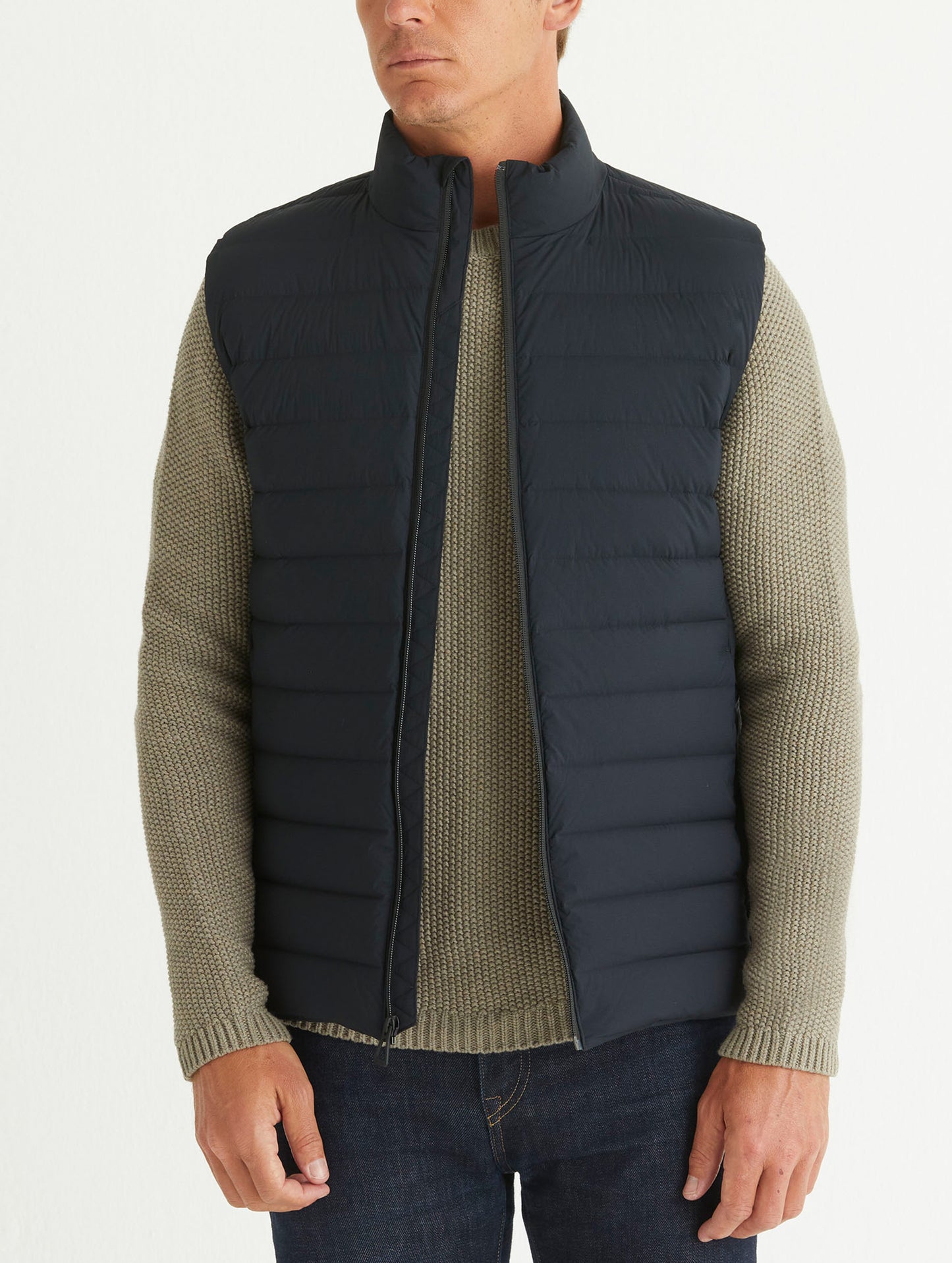 Front body view of man wearing Launch Vest in Onyx Black from AETHER Apparel.