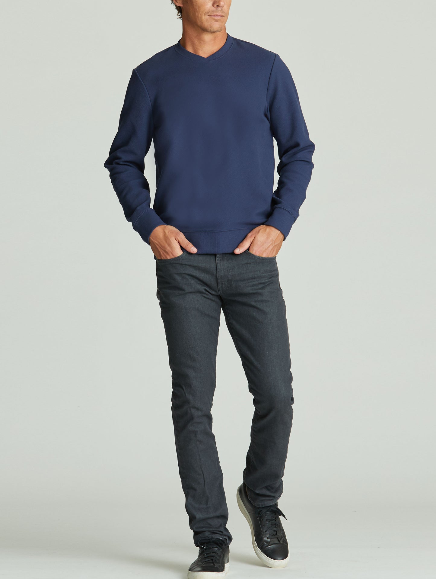 man wearing blue pullover