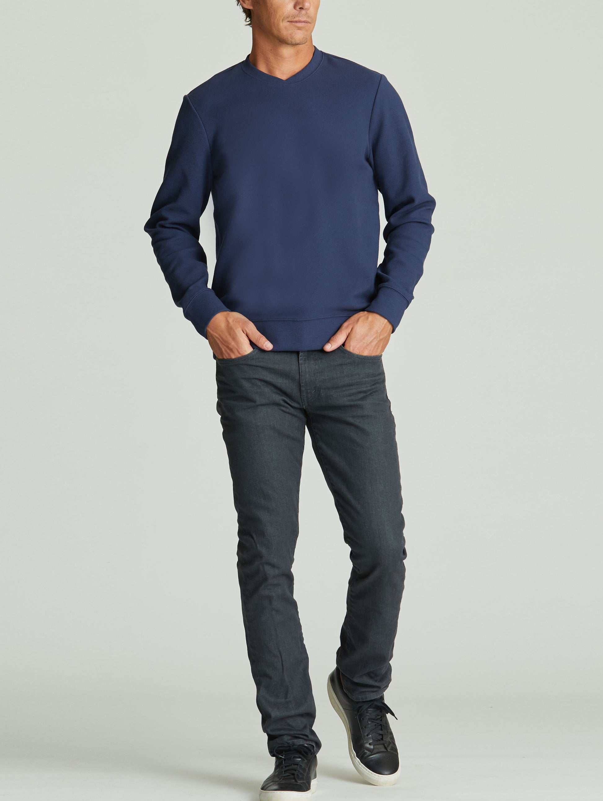 man wearing blue pullover