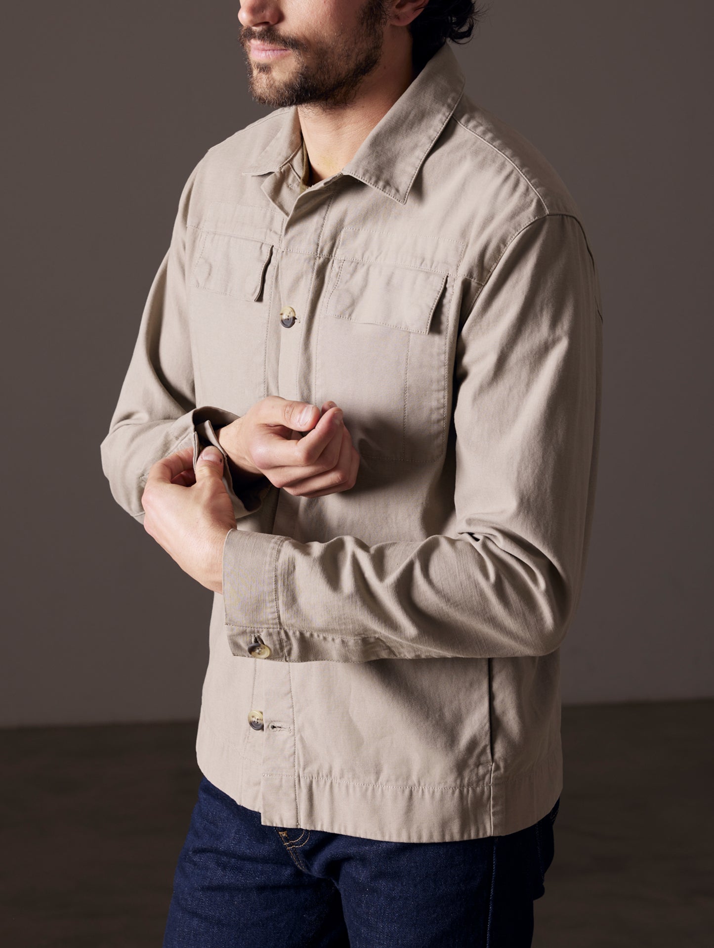 Front 3/4 body view of man wearing Mesa Jacket in Laurel Grey from AETHER Apparel.
