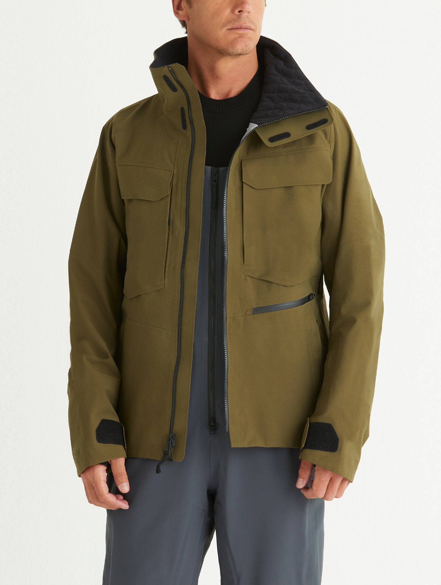 Front body view of man wearing Mission Snow Shell in Command Green from AETHER Apparel.
