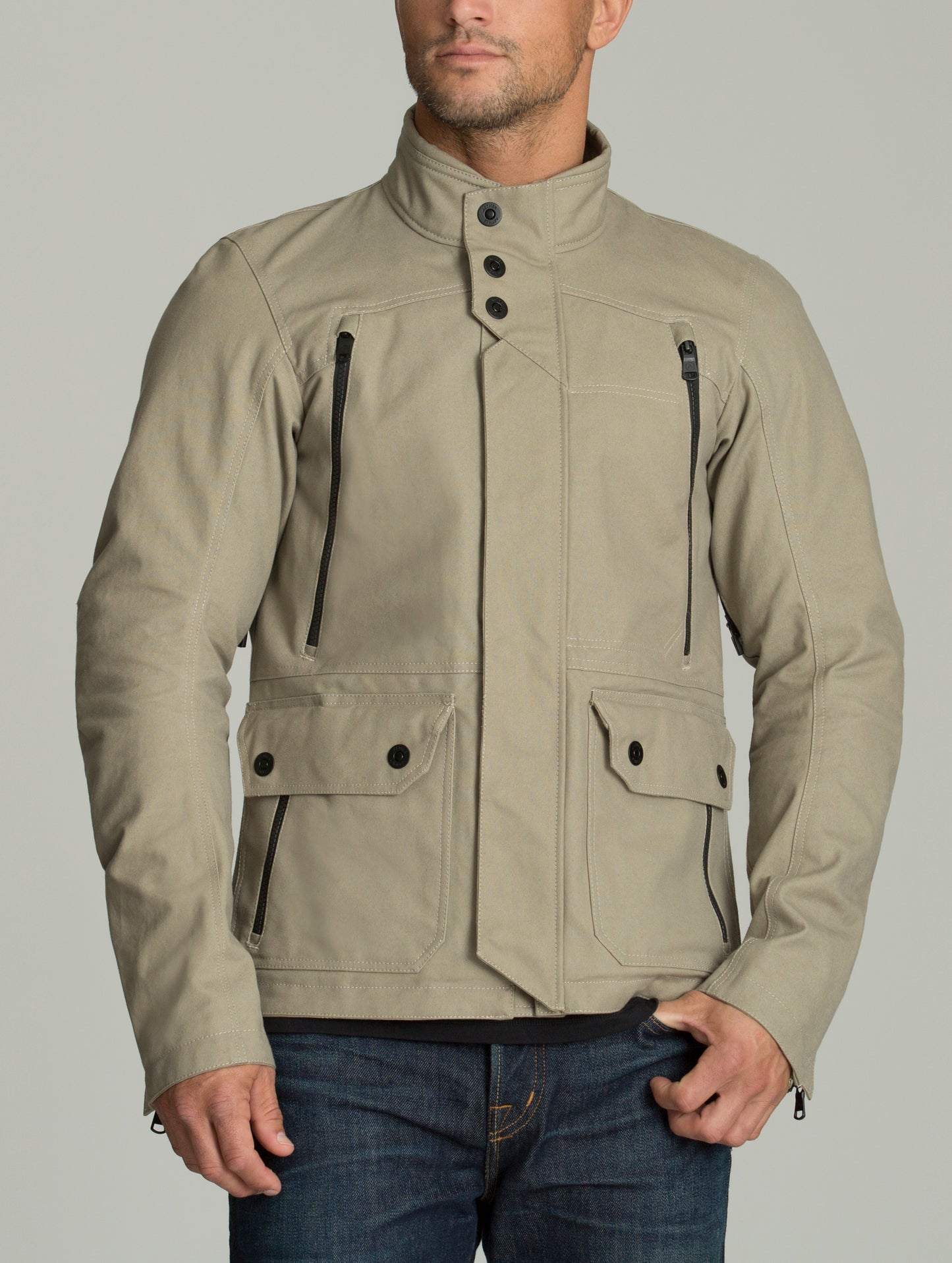 Front body view of man wearing Mojave Motorcycle Jacket in Dark Sand from AETHER Apparel.