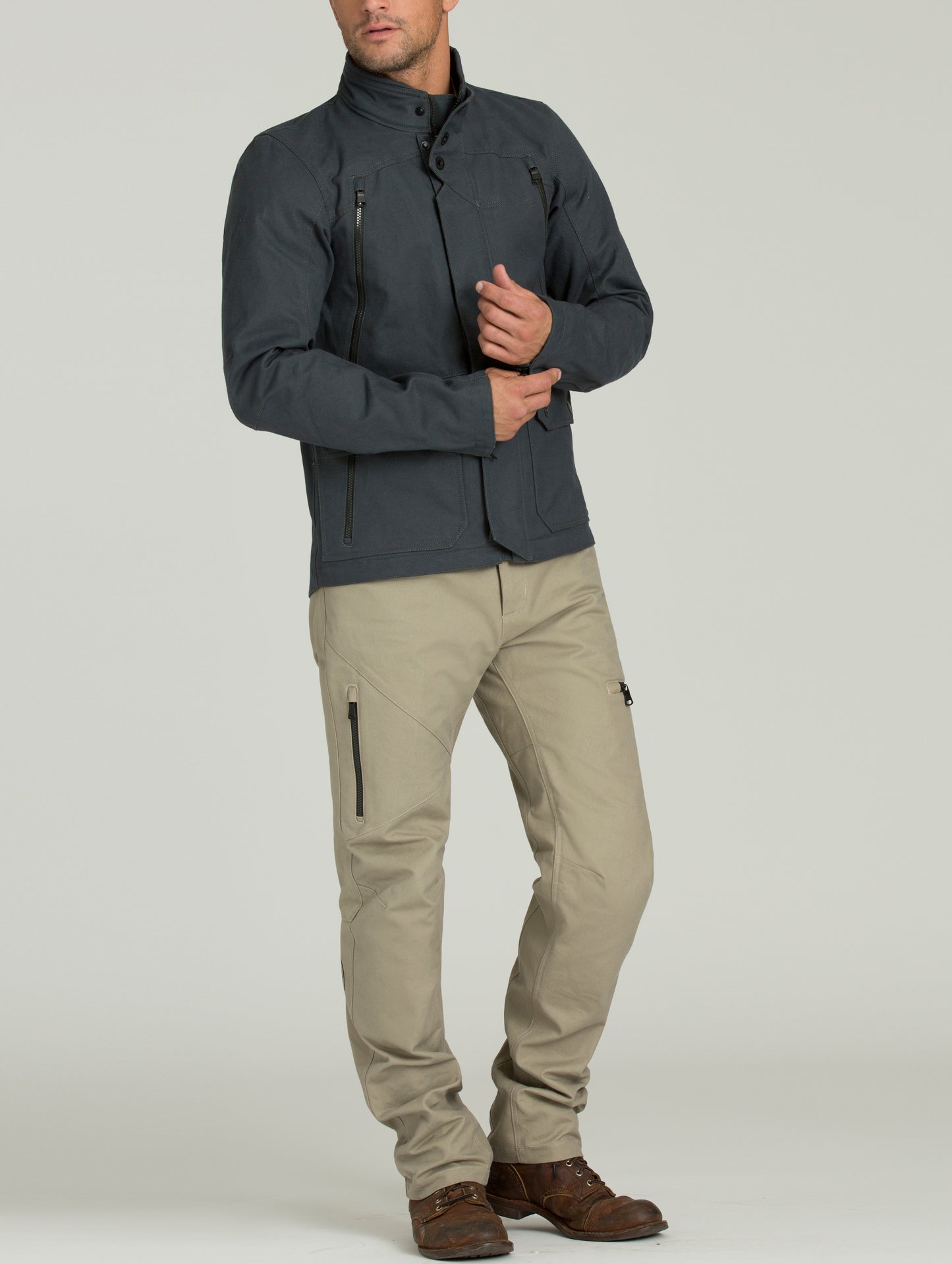 Front full-body view of man wearing Mojave Motorcycle Jacket in Graphite from AETHER Apparel.