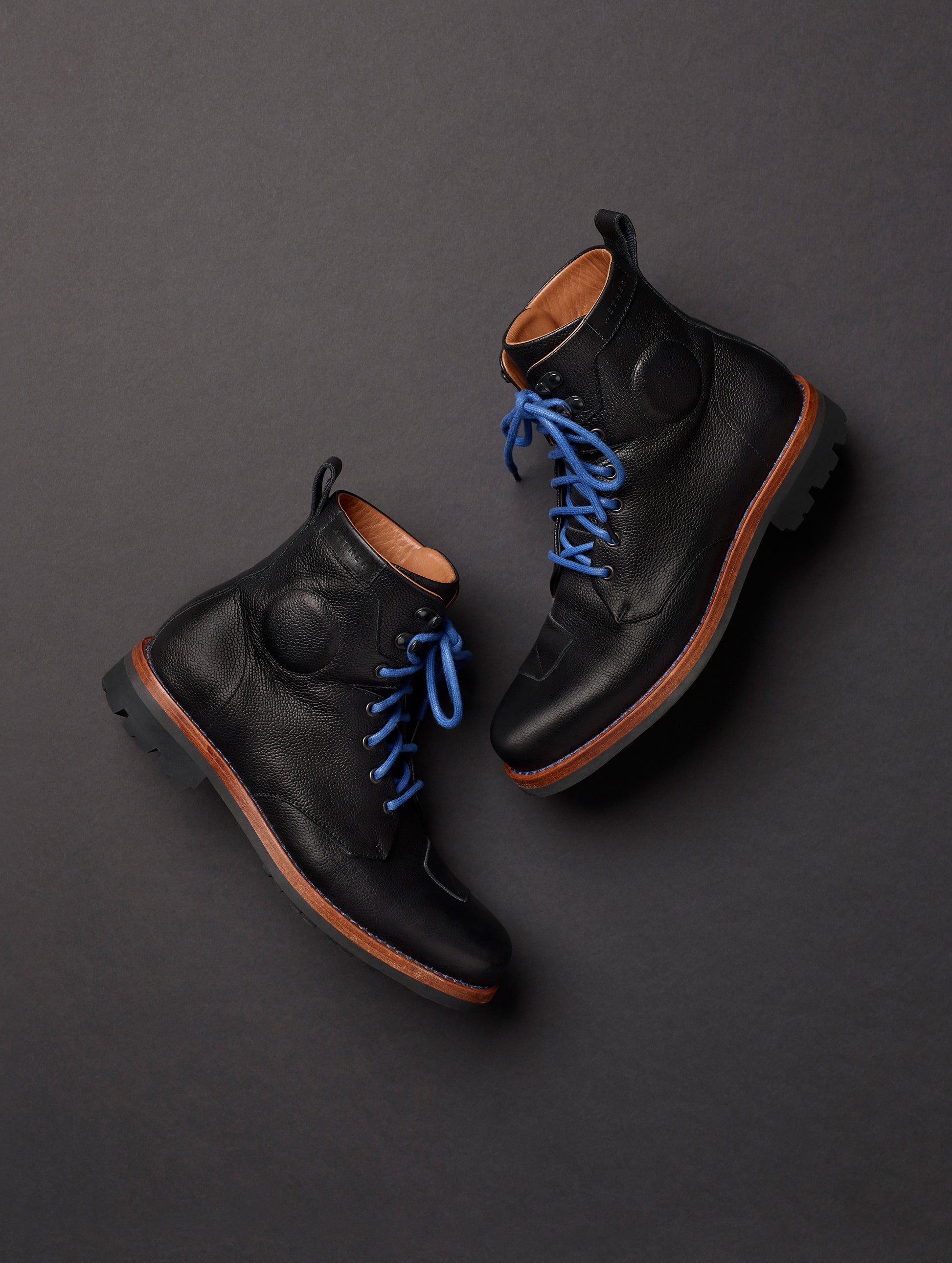 Flat lay of AETHER Moto Boot in Jet Black from AETHER Apparel.