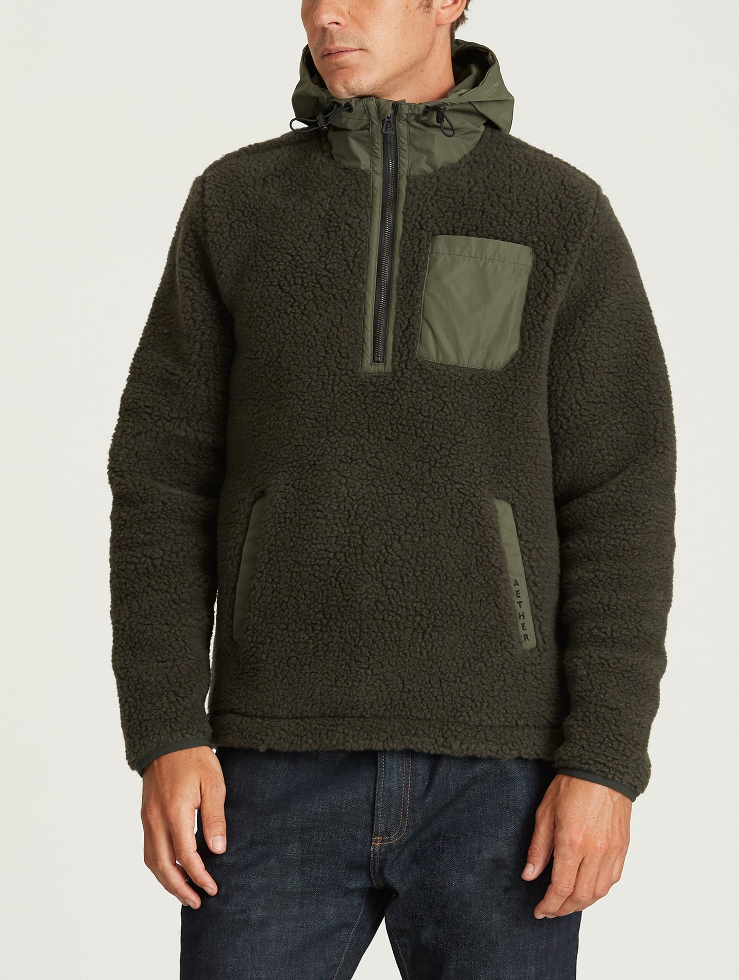 Front body view of man wearing Narrows Pullover in Duffle Green from AETHER Apparel.