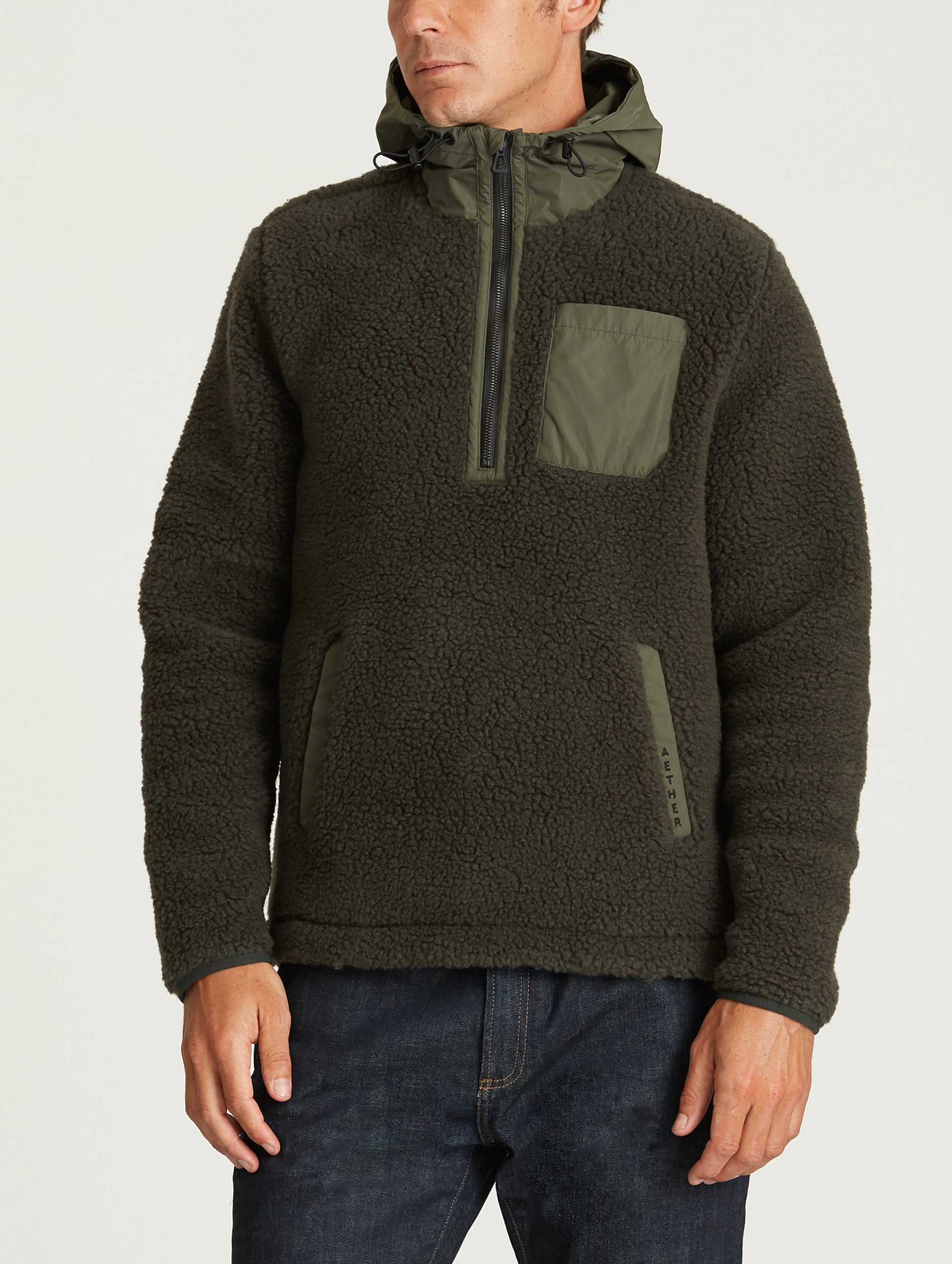 Front body view of man wearing Narrows Pullover in Duffle Green from AETHER Apparel.