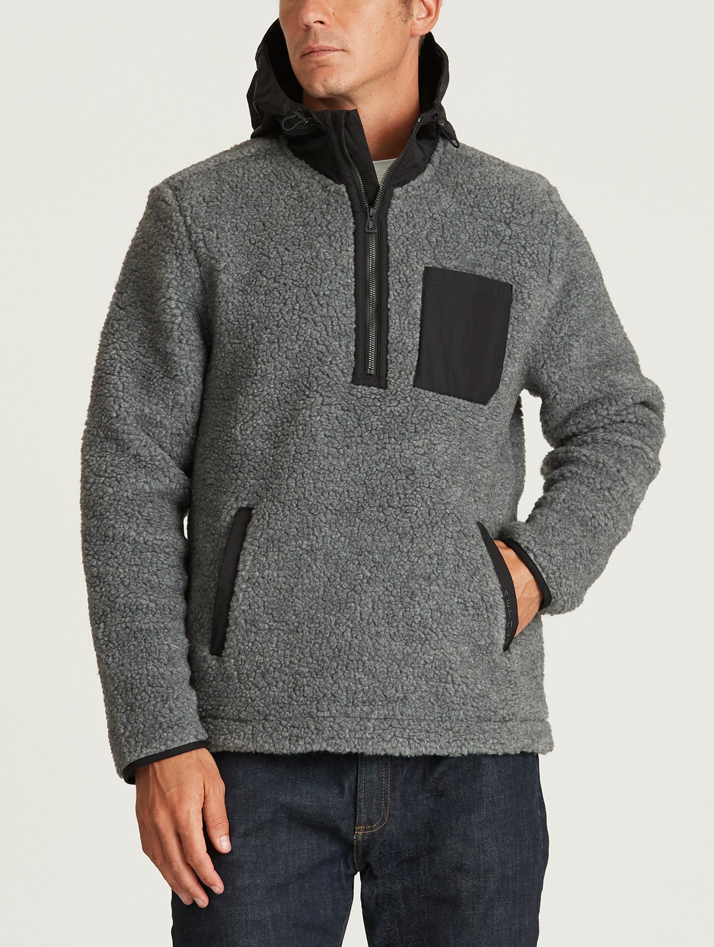 Front body view of man wearing Narrows Pullover in Rocket Grey from AETHER Apparel.