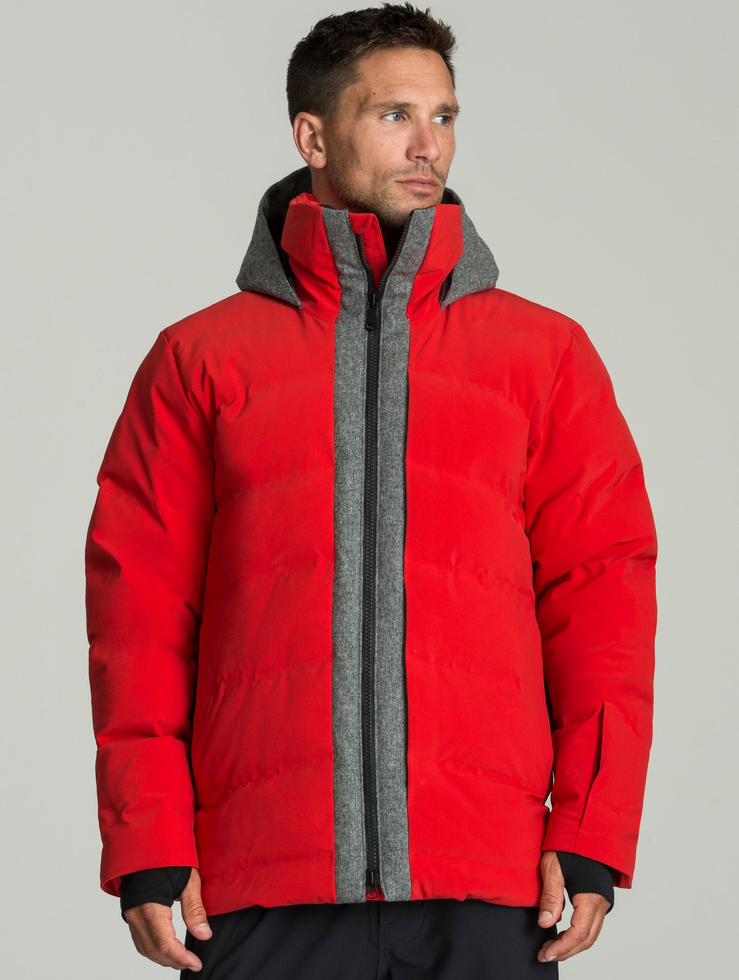 Front body view of man wearing Nordic Jacket in Racing Red from AETHER Apparel.