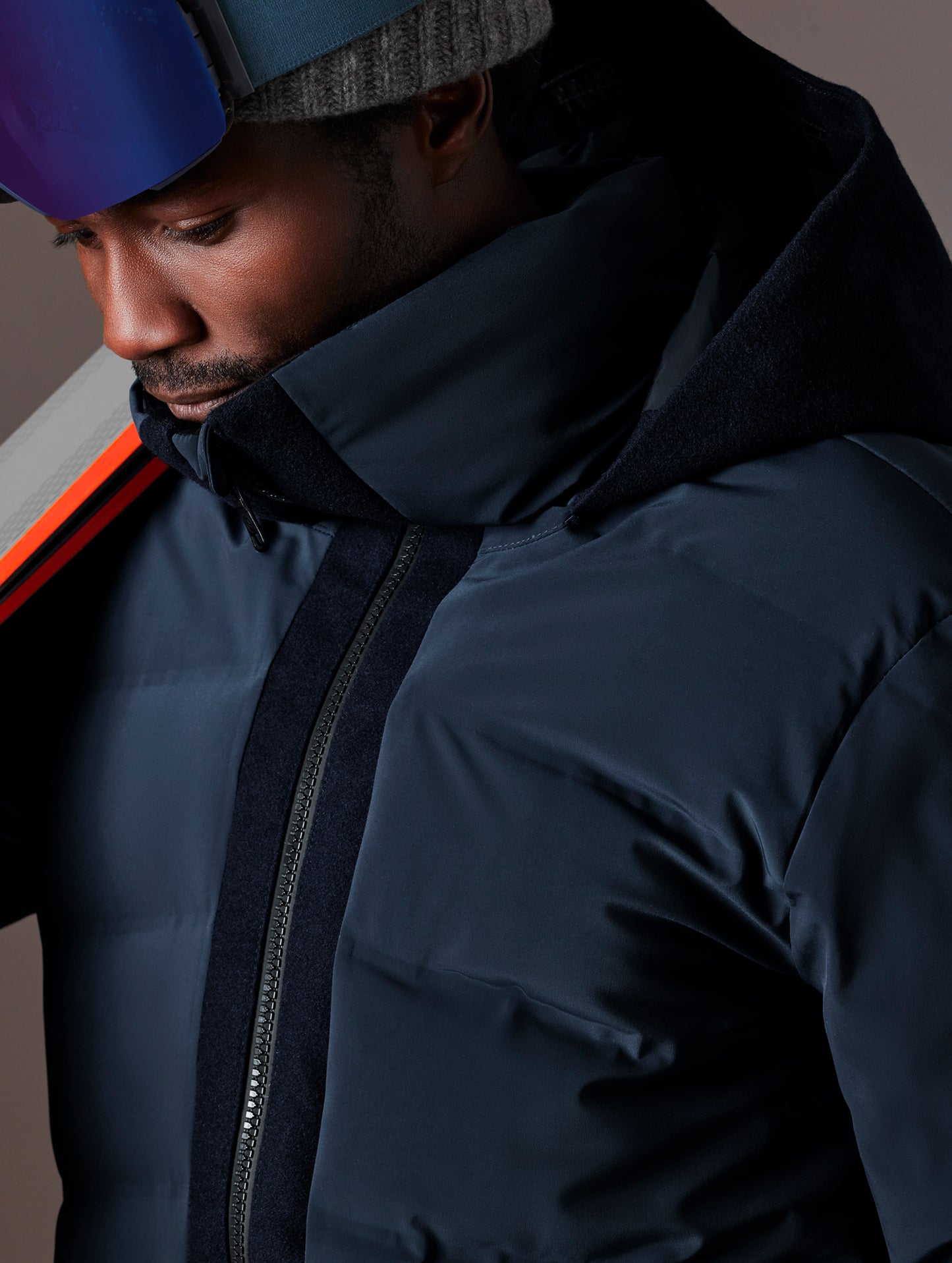 Closeup detailed view of zipper, stitching, and collar on Nordic Jacket in Total Eclipse dark blue from AETHER Apparel.