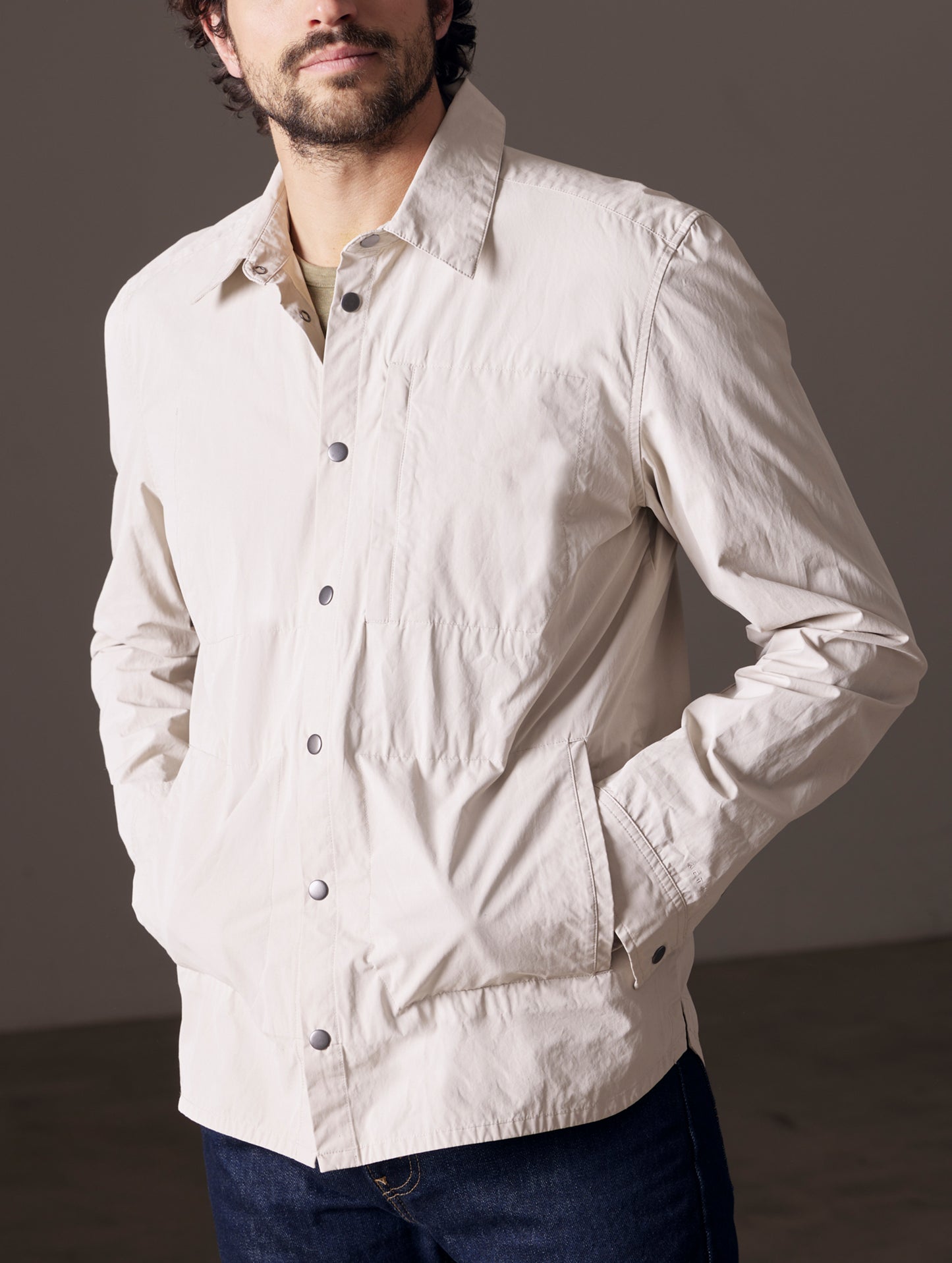 Man wearing beige shirt jacket from AETHER Apparel