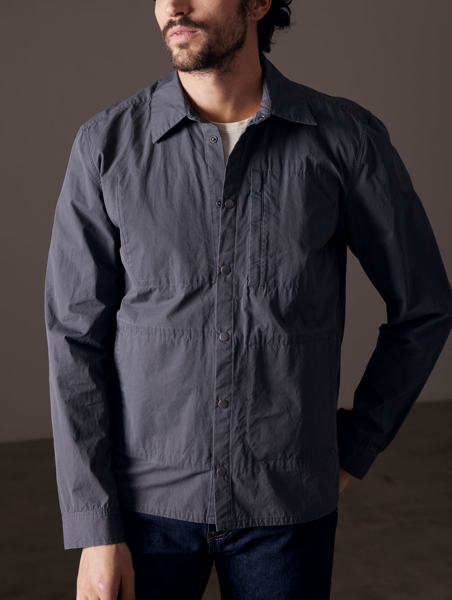 Front body view of man wearing Pine Shacket in Graphite from AETHER Apparel.