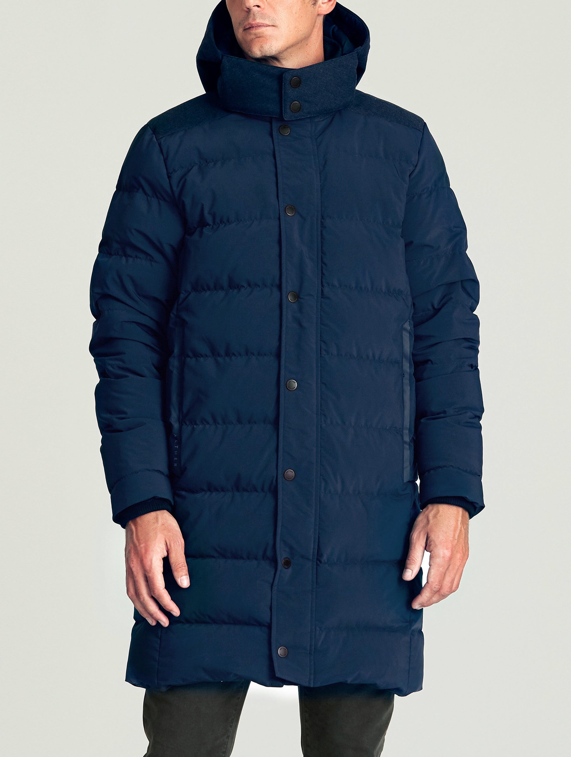 Front body view of man wearing Scott Parka in Nordic Navy blue from AETHER Apparel.
