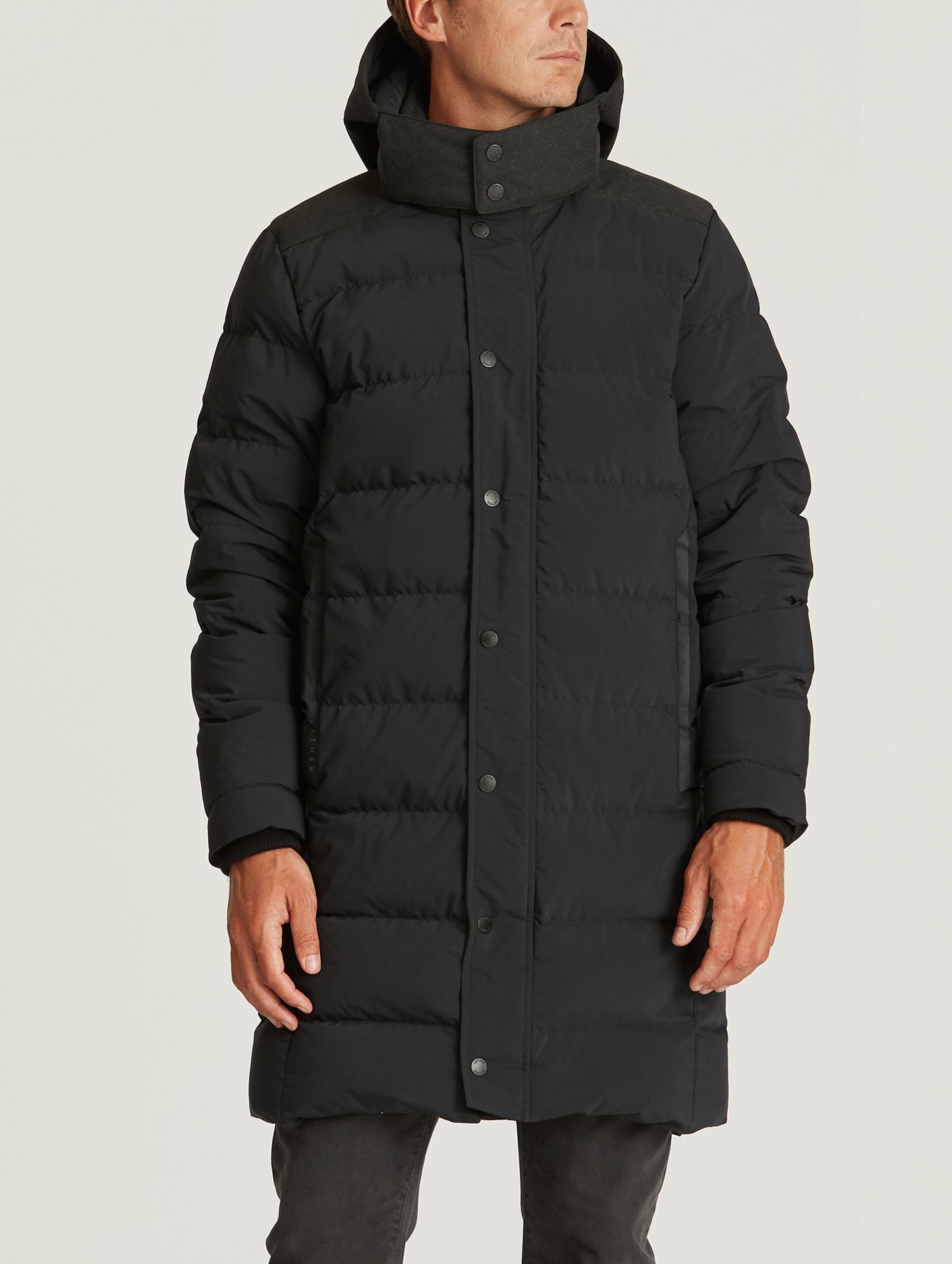man wearing black parka from AETHER Apparel