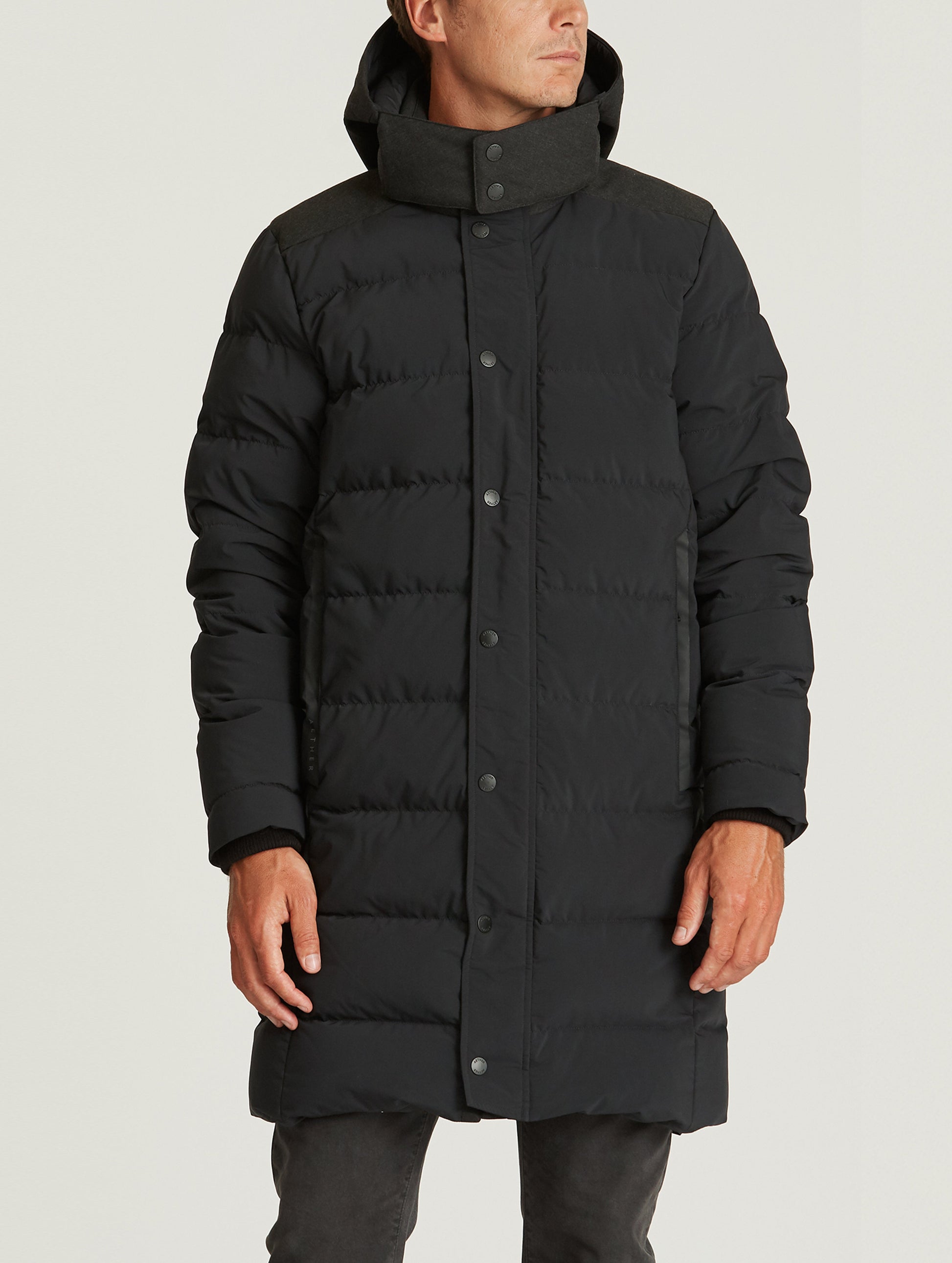 man wearing black parka from AETHER Apparel