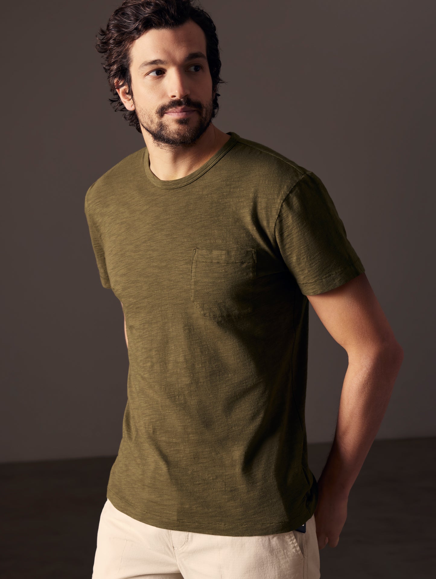 man wearing green tee from AETHER Apparel