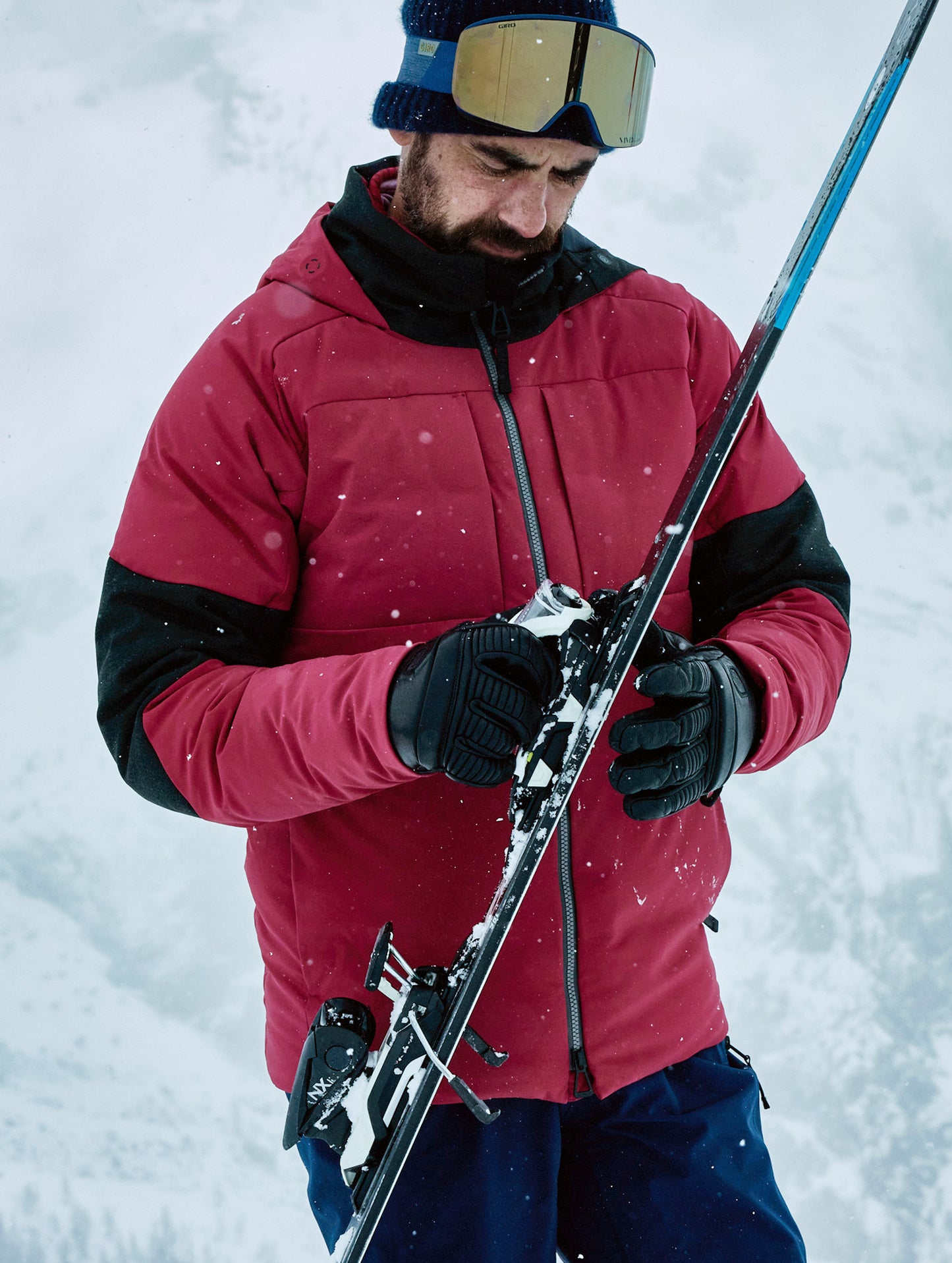man wearing red ski jacket from Aether Apparel