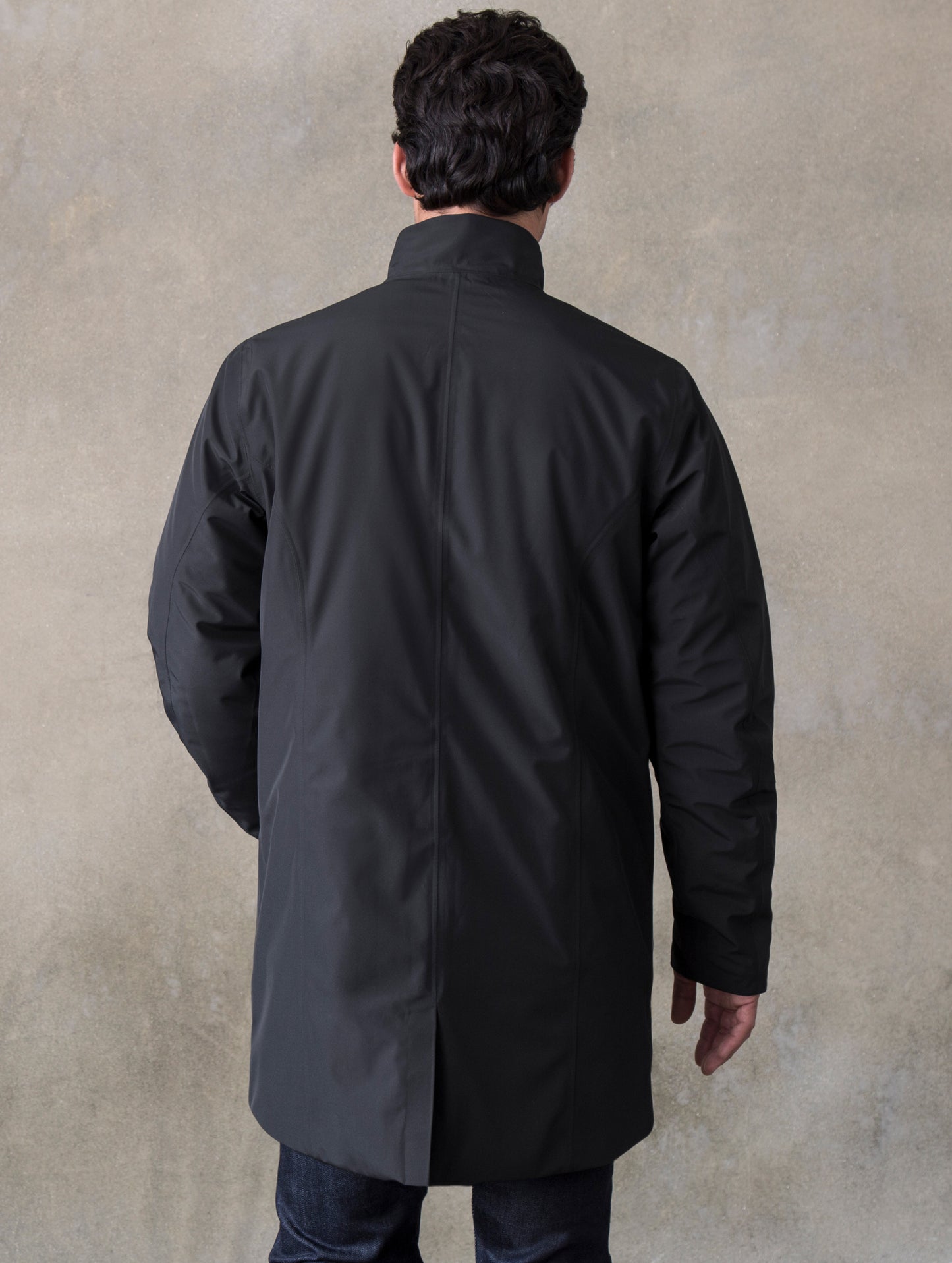 Back of man wearing black Tundra Jacket from ATHER Apparel.