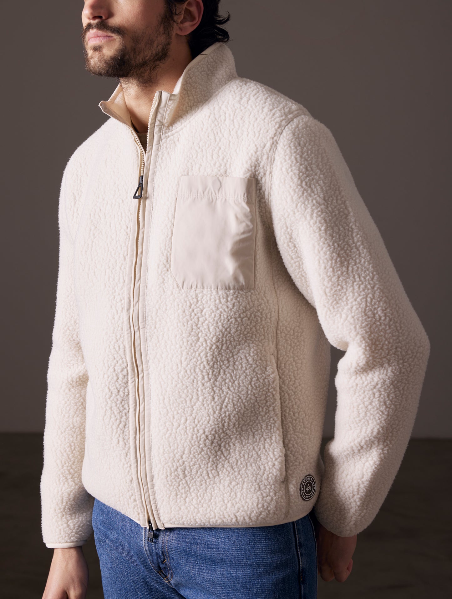 man wearing beige fleece full-zip