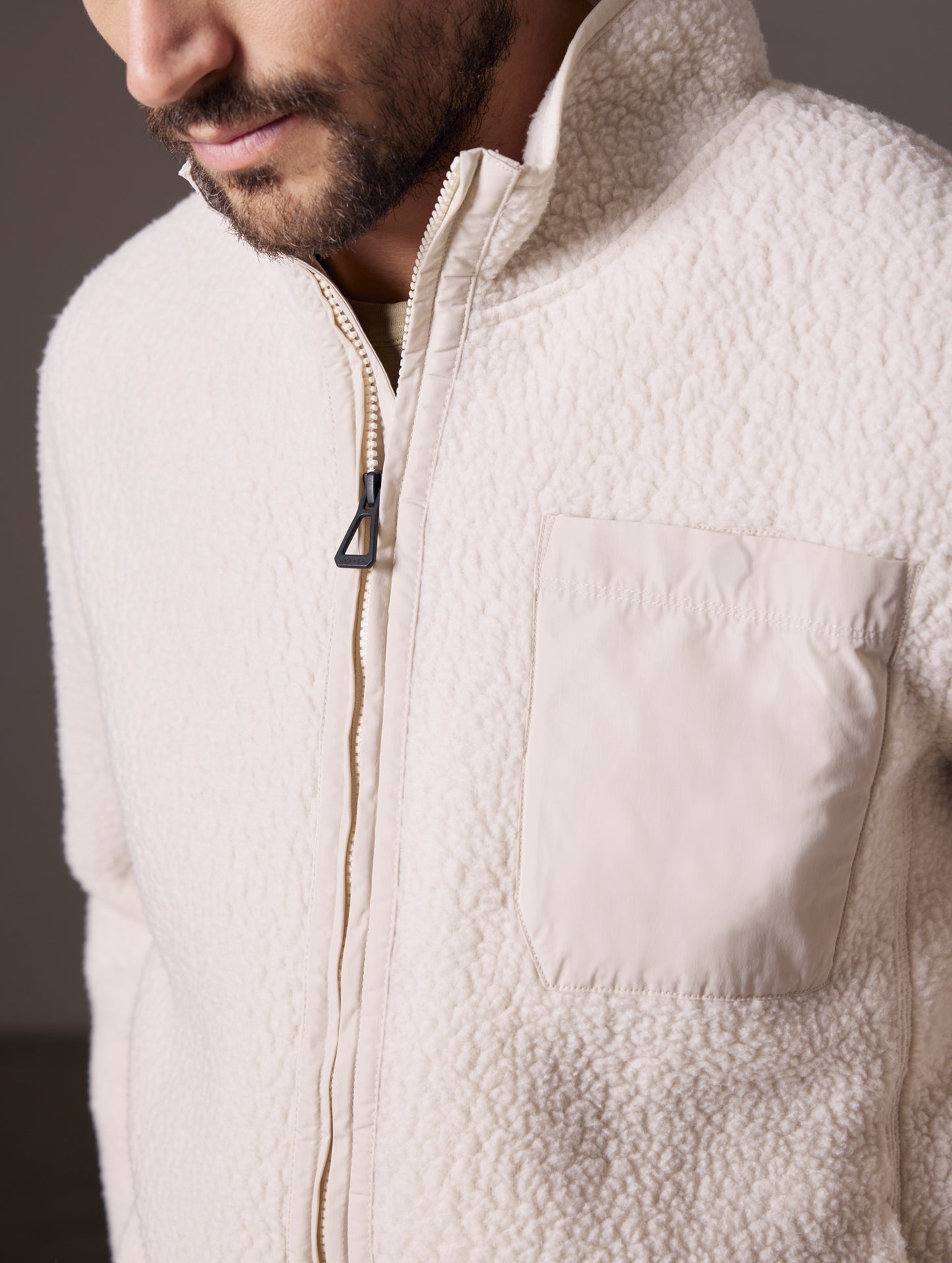 man wearing beige fleece full-zip