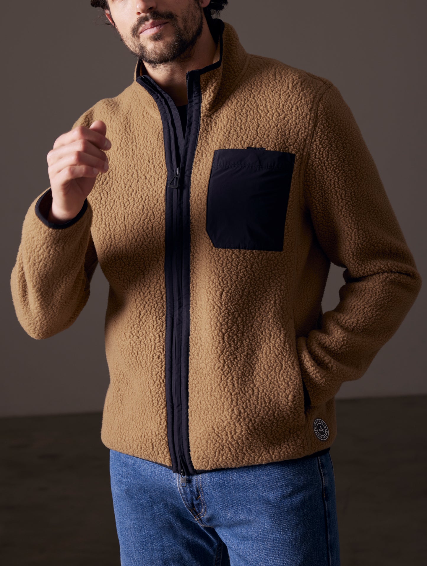 Front body view of man wearing Walsh Full-Zip in Reserve Brown from AETHER Apparel.