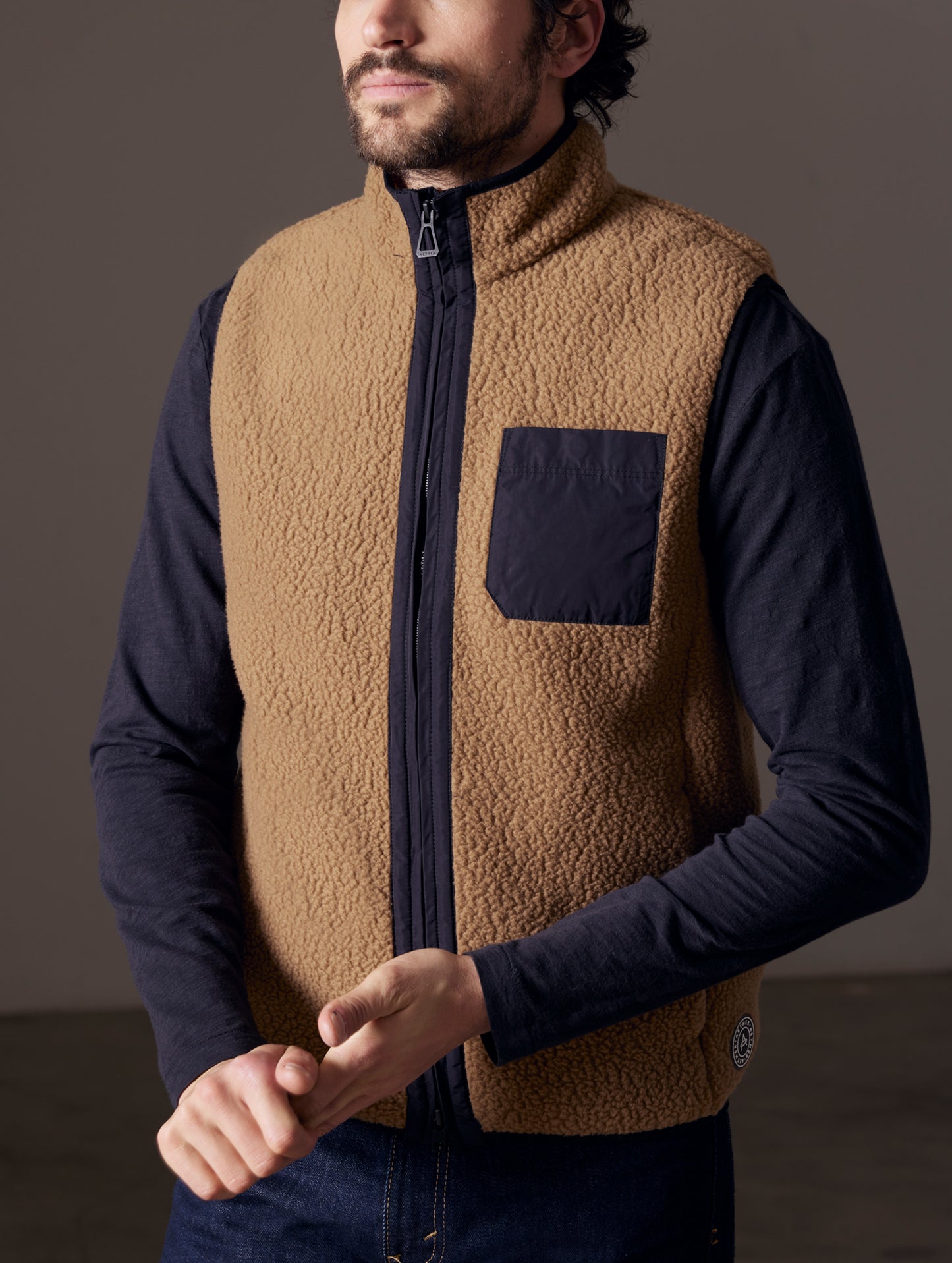 Front body view of man wearing Walsh Vest in Reserve Brown from AETHER Apparel.