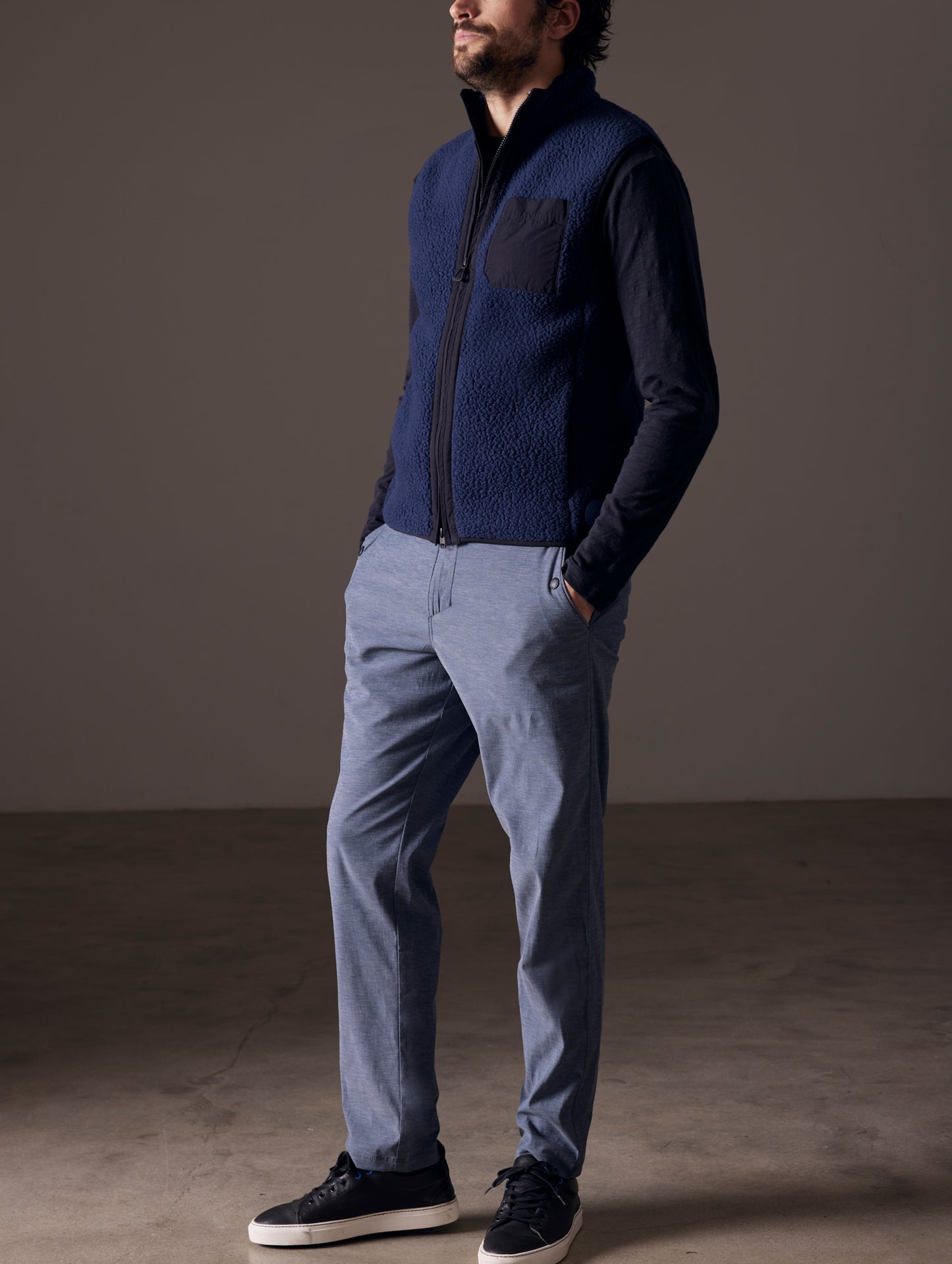 Front 3/4 full-body view of man wearing Walsh Vest in Nordic Navy from AETHER Apparel.