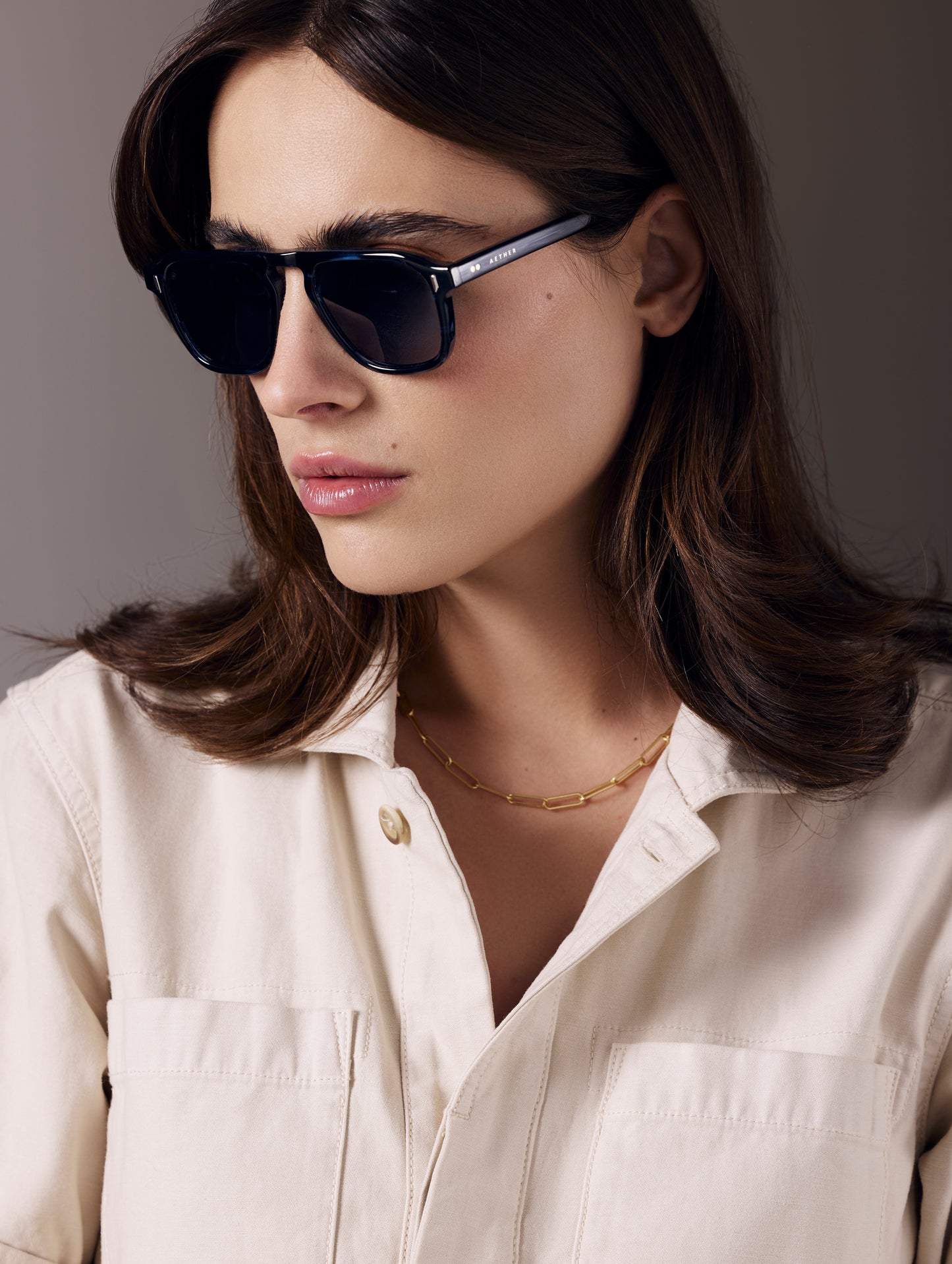 Front 3/4 view of woman wearing Sequoia Sunglass in Blue Tortoise with Blue Lens from AETHER Apparel.