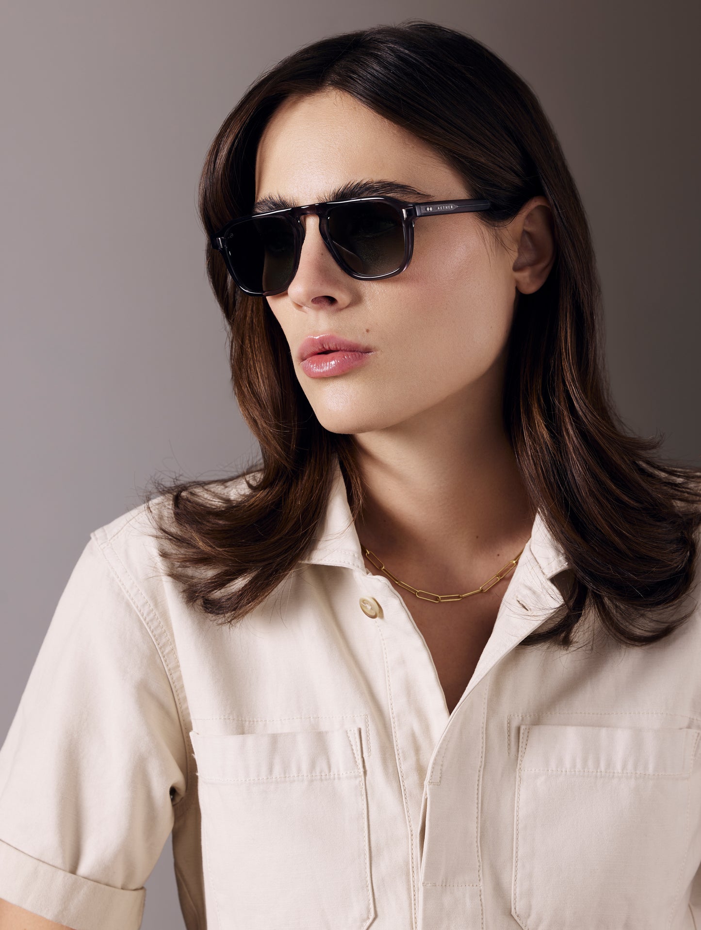 Front 3/4 view of woman wearing Sequoia Sunglass in Grey with G15 Lens from AETHER Apparel.