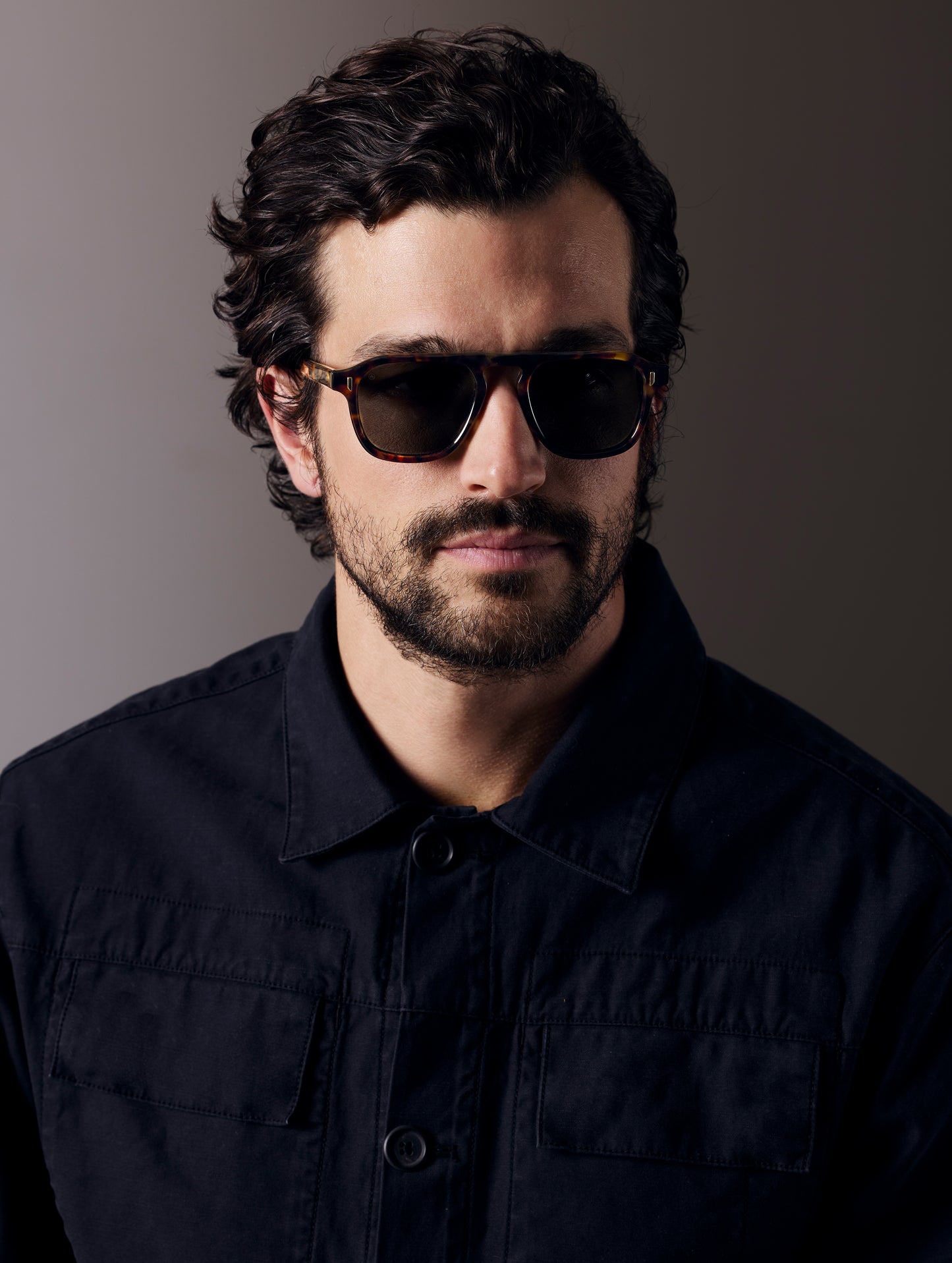 Front right 3/4 view of man wearing Sequoia Sunglass in Tortoise with Deep G15 Lens from AETHER Apparel.