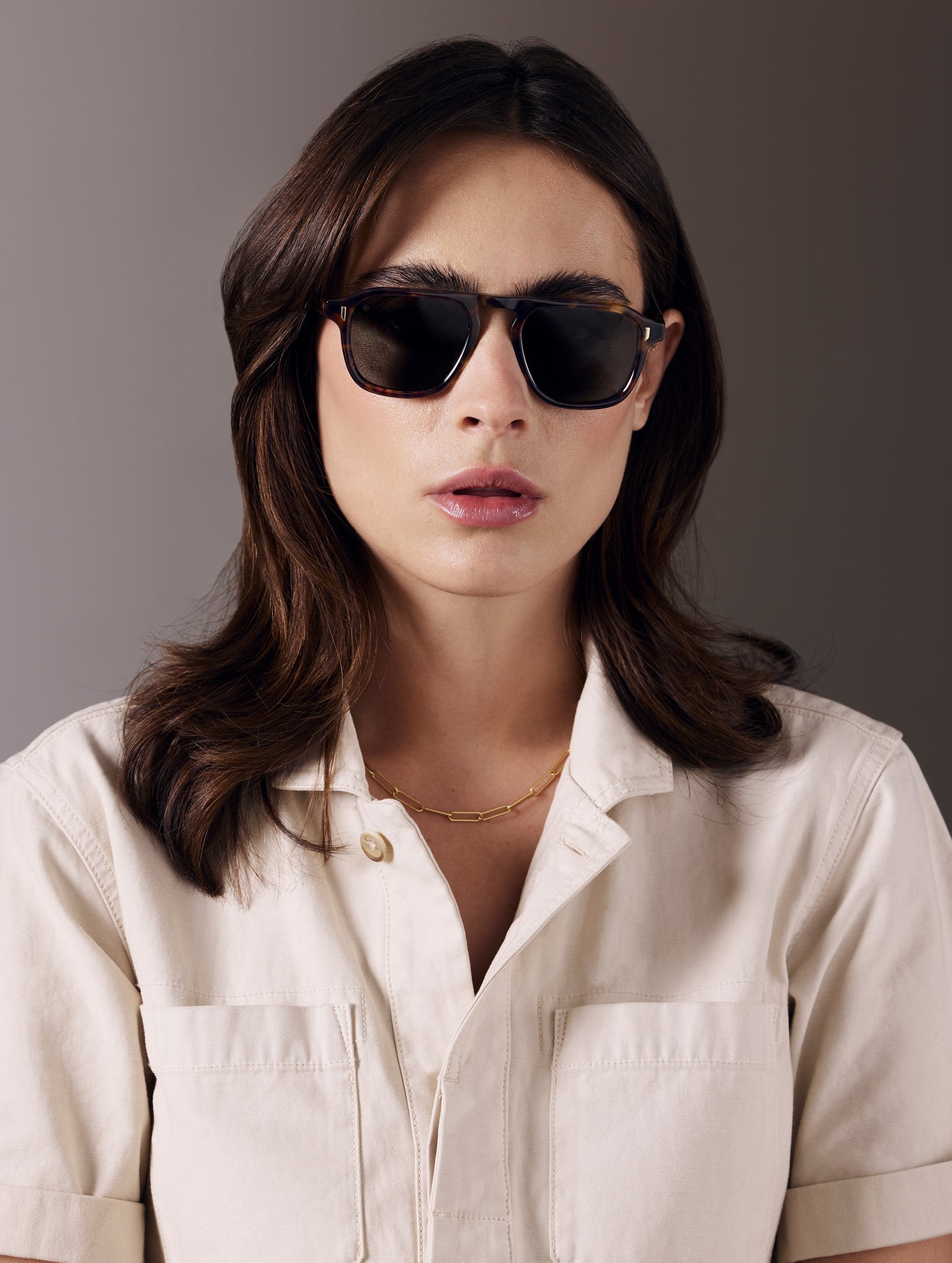 Front view of woman wearing Sequoia Sunglass in Tortoise with Deep G15 Lens from AETHER Apparel.