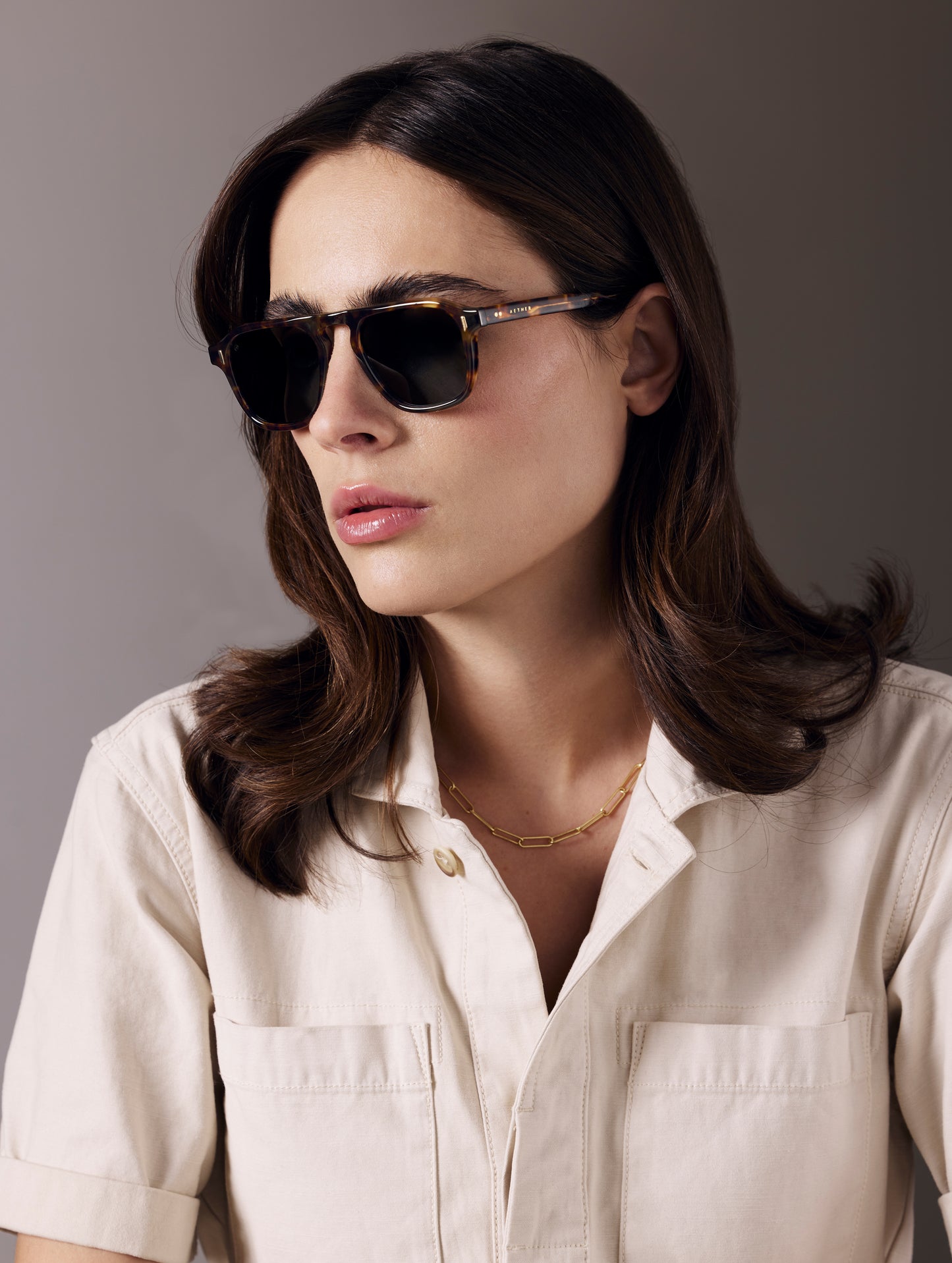 Front 3/4 view of woman wearing Sequoia Sunglass in Tortoise with Deep G15 Lens from AETHER Apparel.
