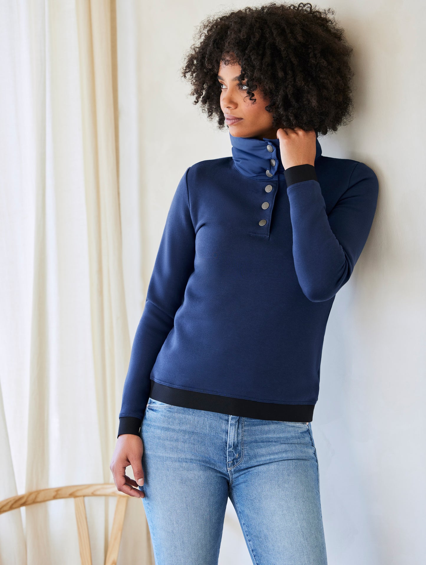 Woman wearing blue Align Pullover from AETHER Apparel