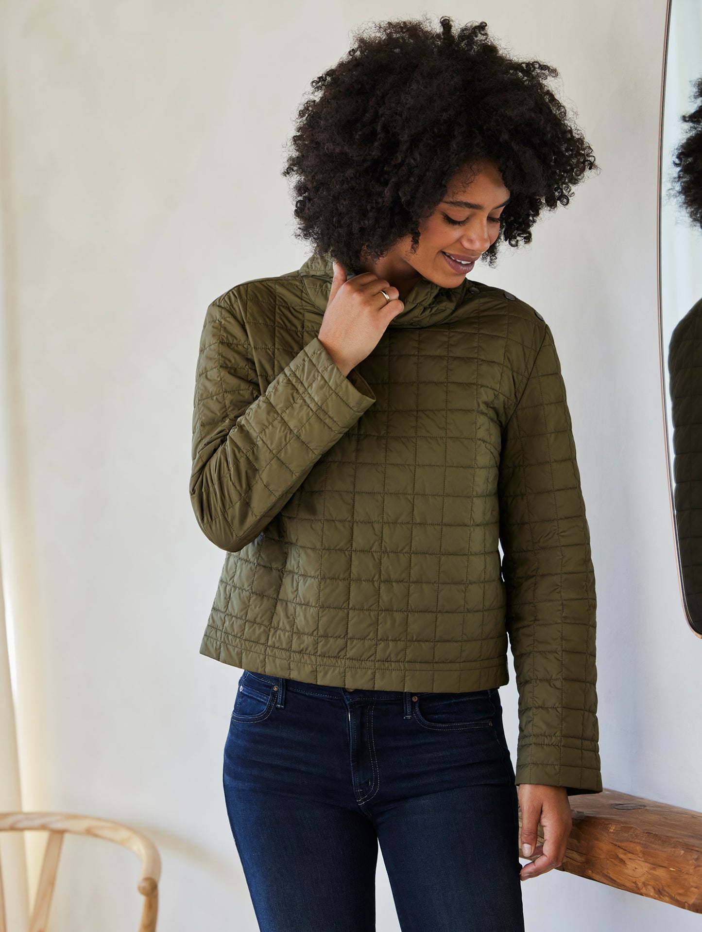 woman wearing quilted green pullover