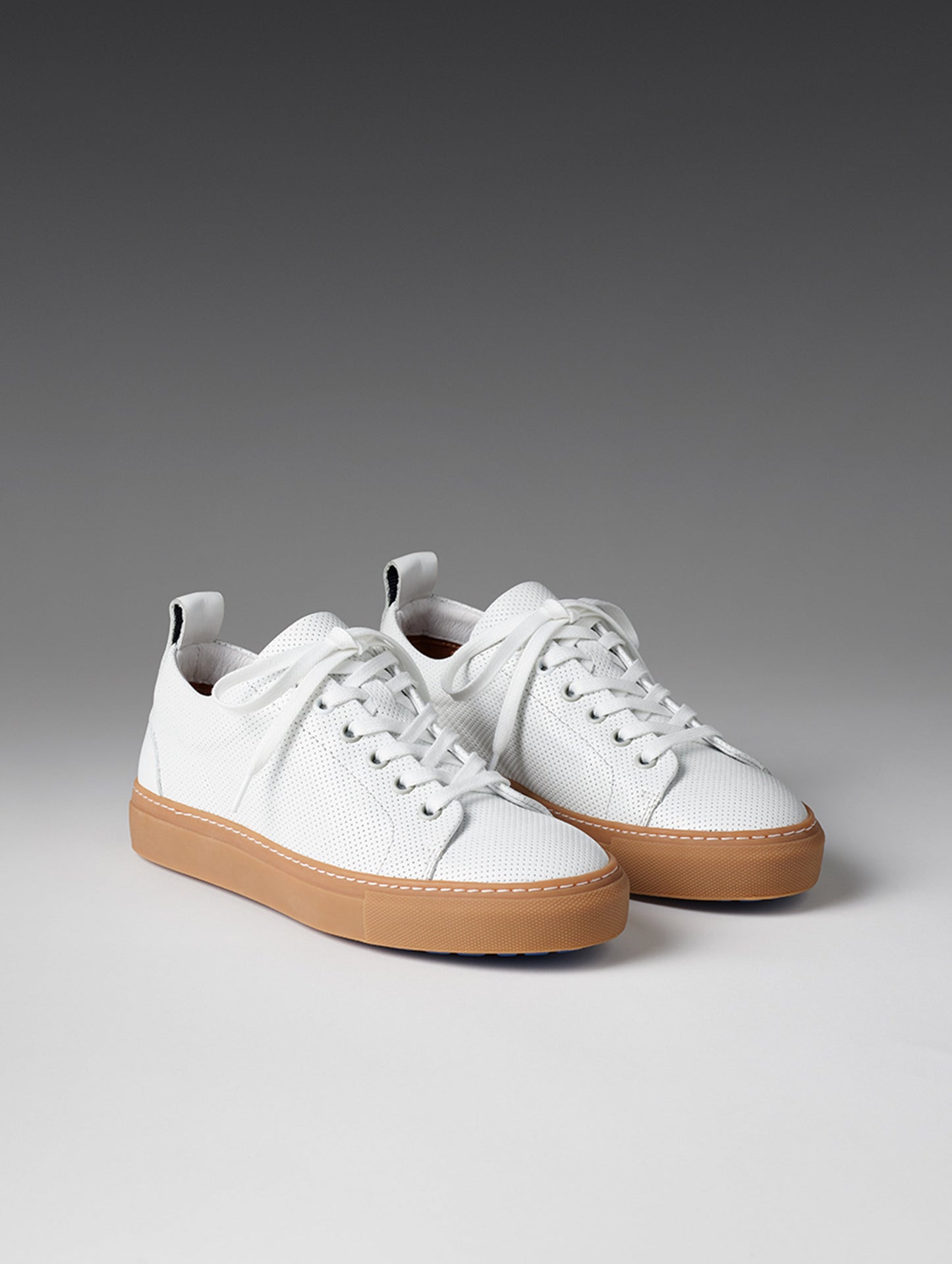 Front angled view of women's Dalton Low-Top Sneaker in White from AETHER Apparel.