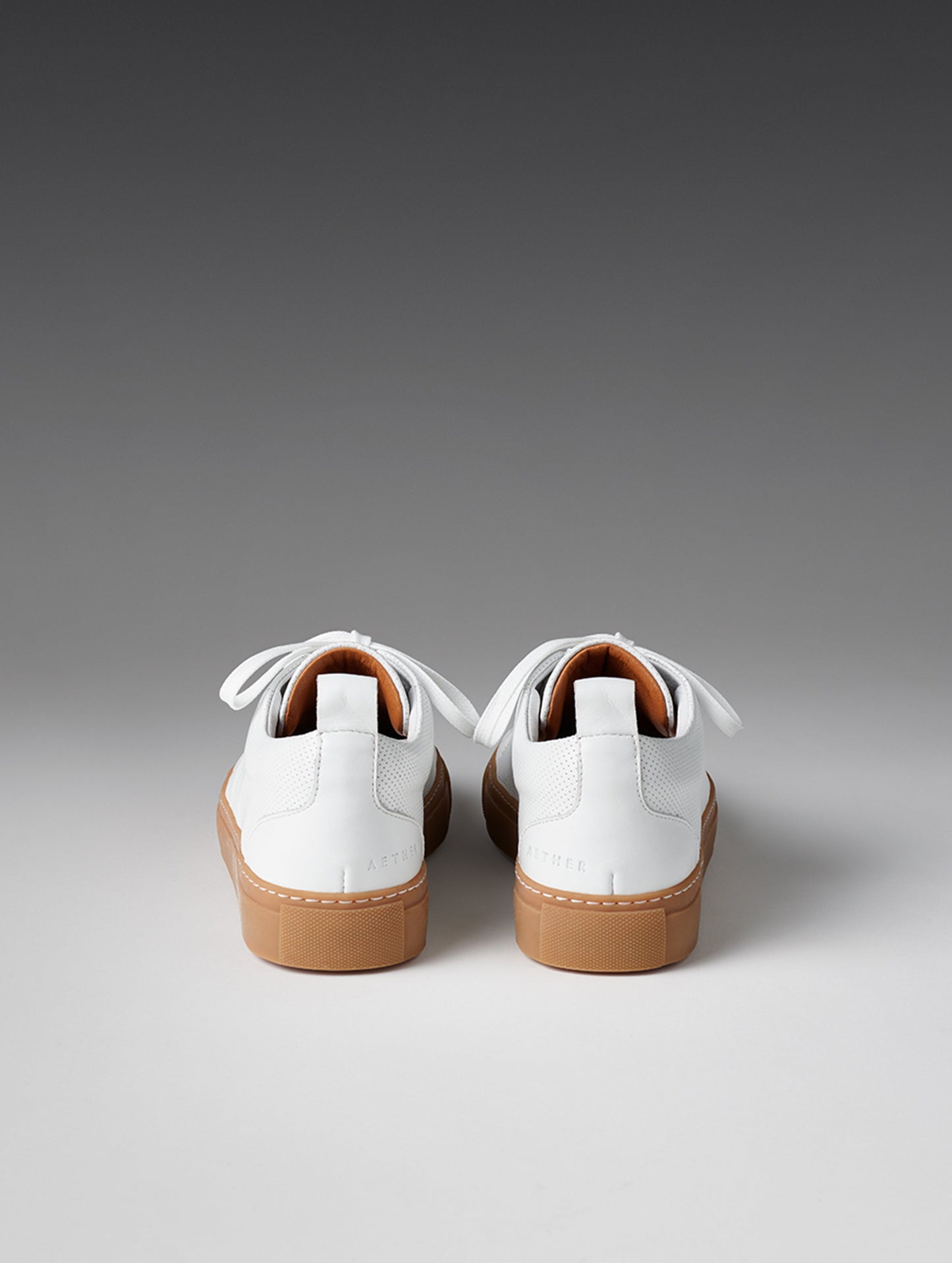 Rear view of women's Dalton Low-Top Sneaker in White from AETHER Apparel.
