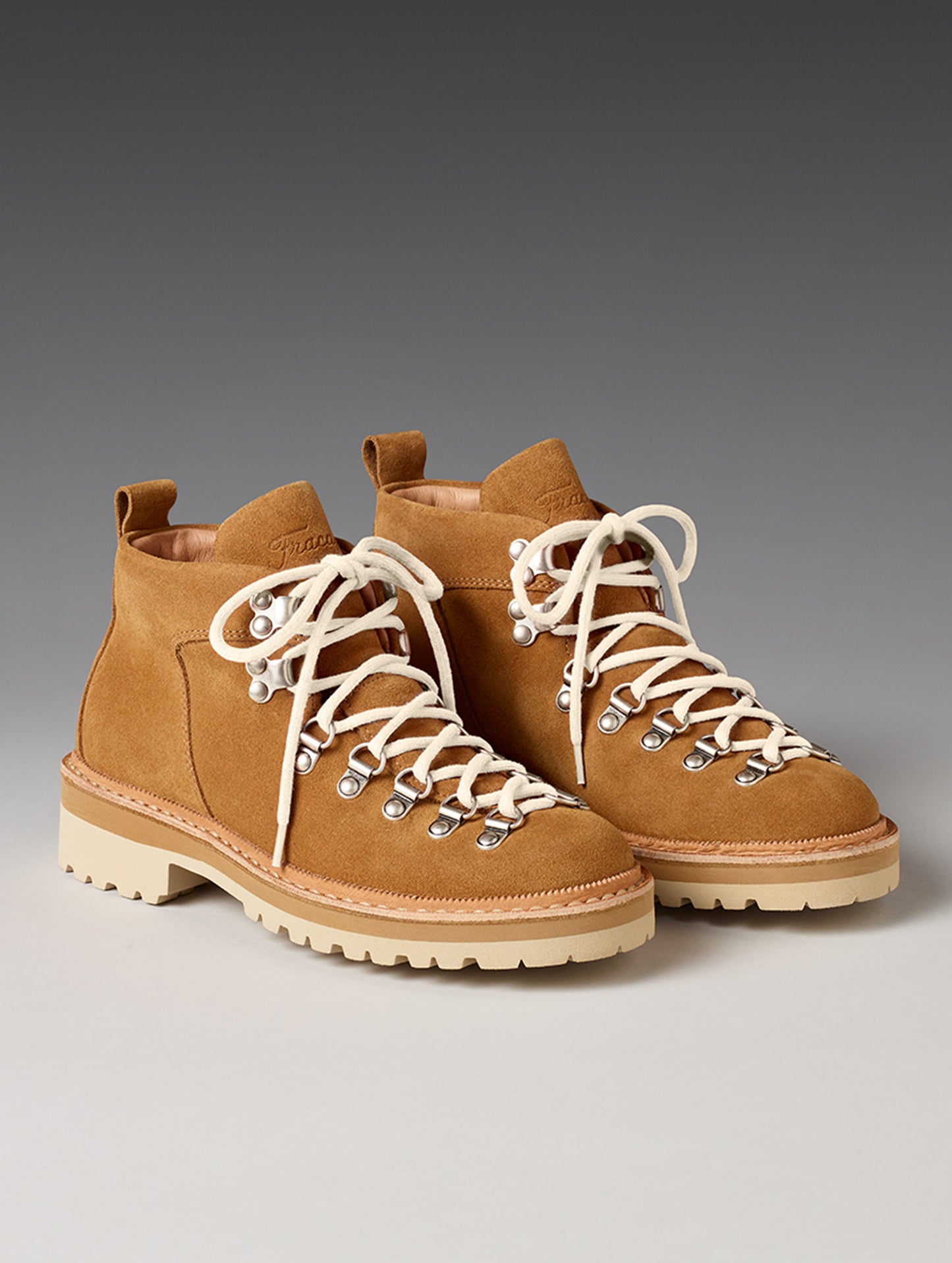 Front angled view of women’s Dolomite Boot in Camel from AETHER Apparel with white laces.