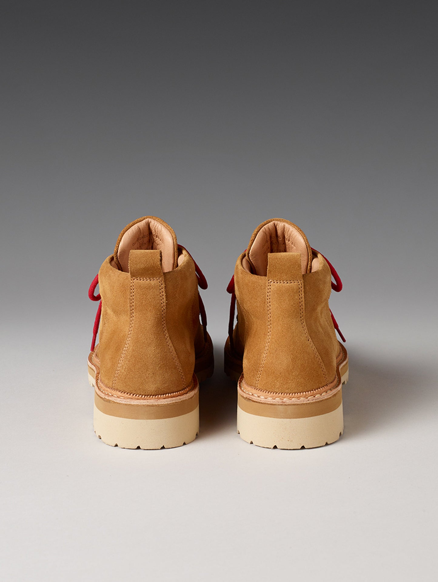 Rear view of women’s Dolomite Boot in Camel from AETHER Apparel with red laces.