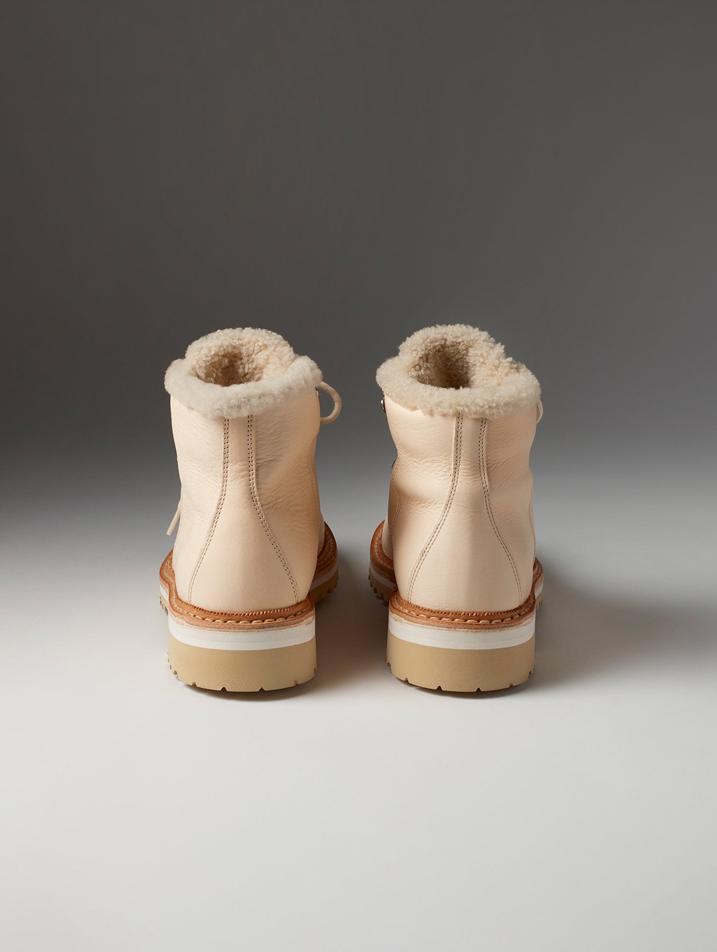 Rear view of women's Dolomite Boot with Shearling in Cream from AETHER Apparel with cream laces.