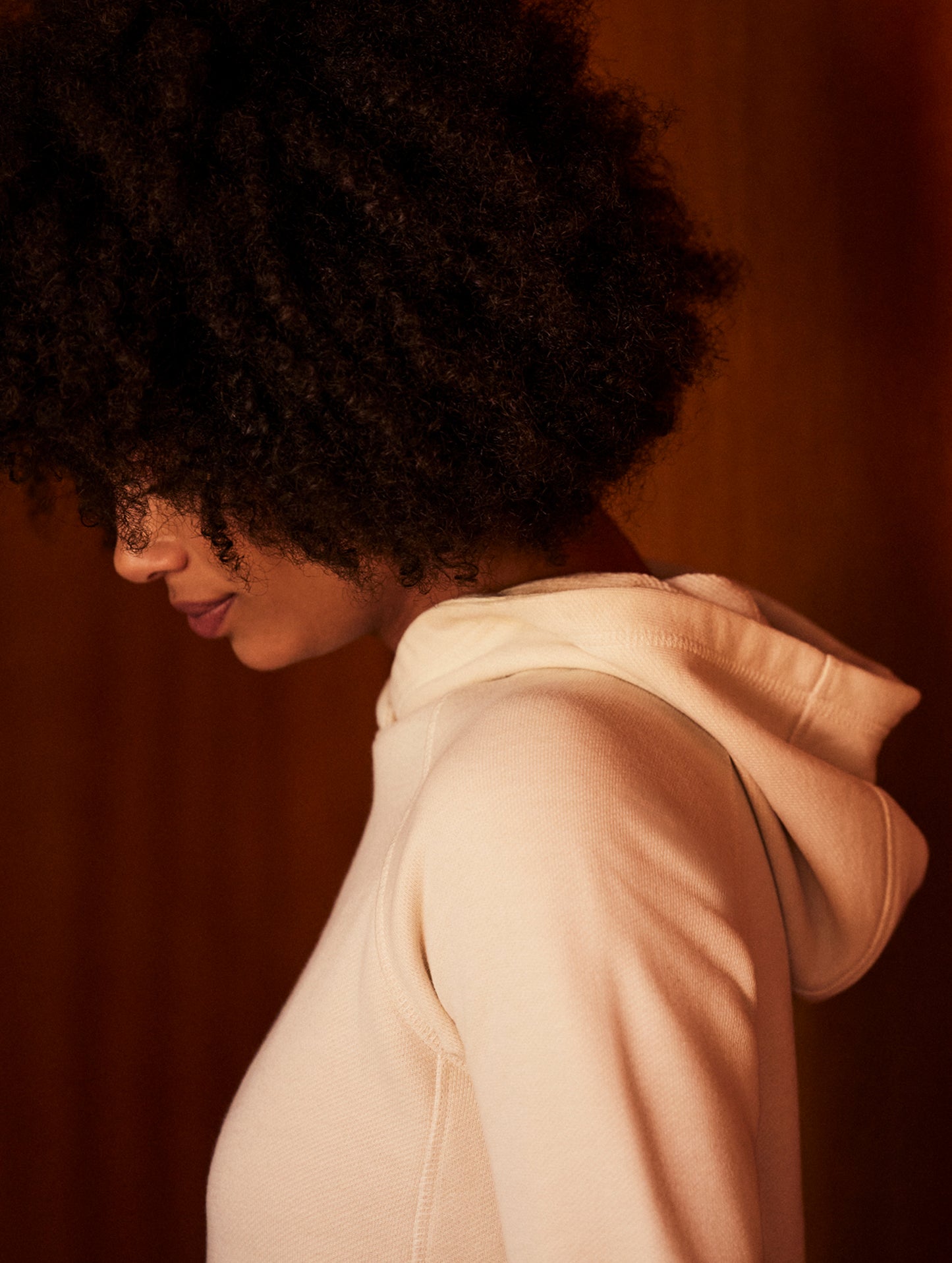Closeup detailed view of shoulder and hood of Foundation Hoodie in Bone white from AETHER Apparel.