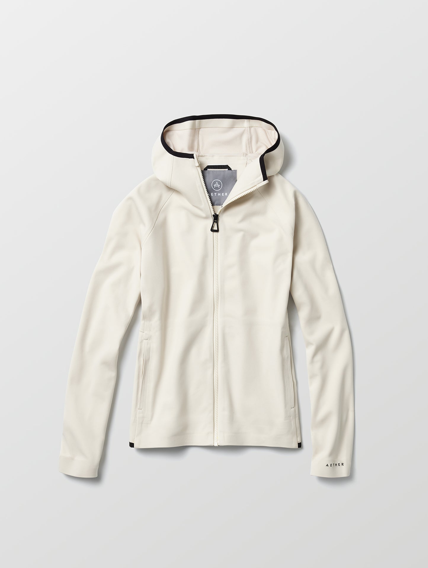 Flat lay of women's Hooded Tech-Fleece Full-Zip in Bone white from AETHER Apparel.