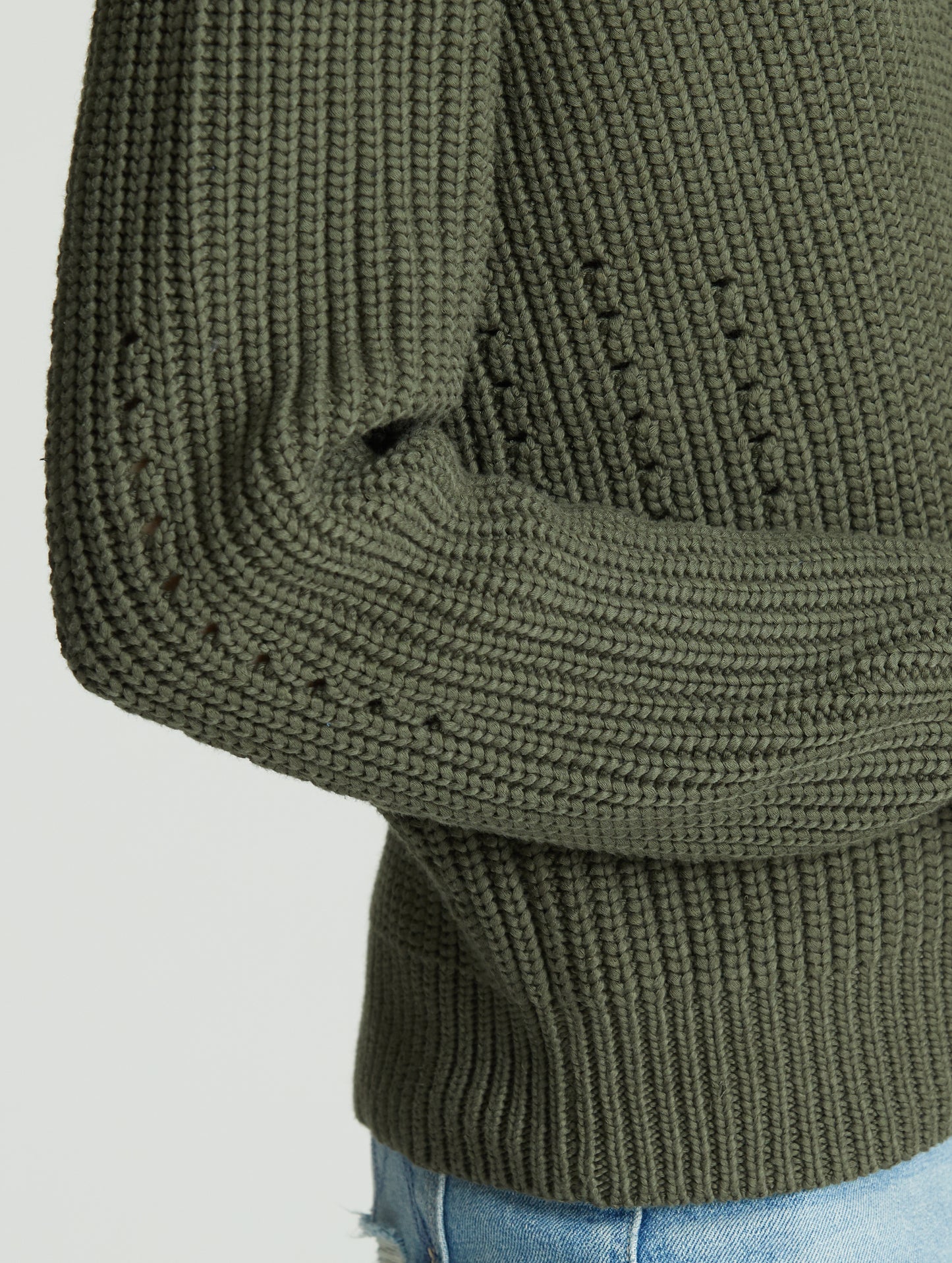 Sleeve of green Keaton Sweater from AETHER Apparel.