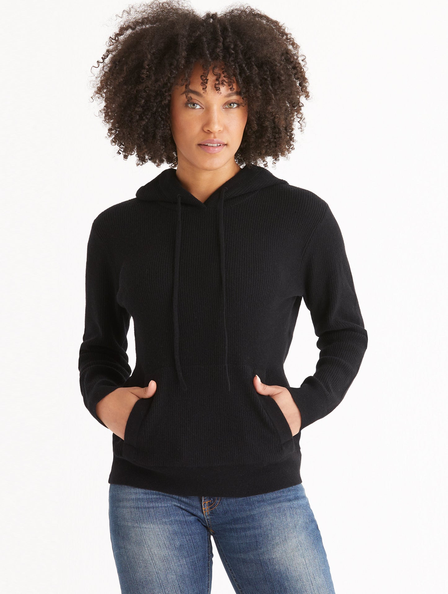 Front view of woman wearing Lawrence Cashmere Hooded Sweater in Onyx Black from AETHER Apparel.
